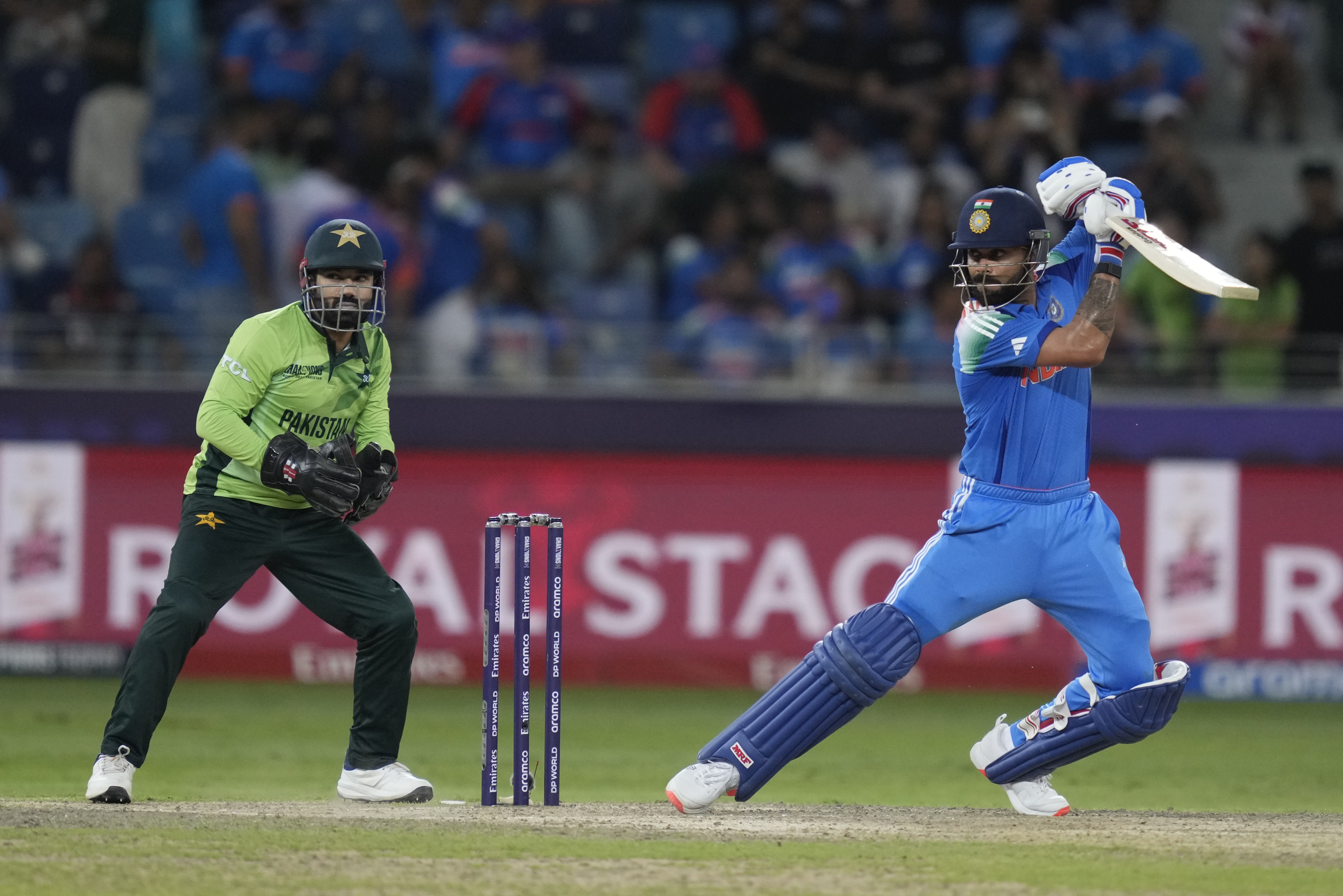 India's Virat Kohli plays a shot during the ICC Champions Trophy cricket match between India and Pakistan at Dubai International Cricket Stadium, United Arab Emirates, Sunday, Feb. 23, 2025. (AP Photo/Altaf Qadri)