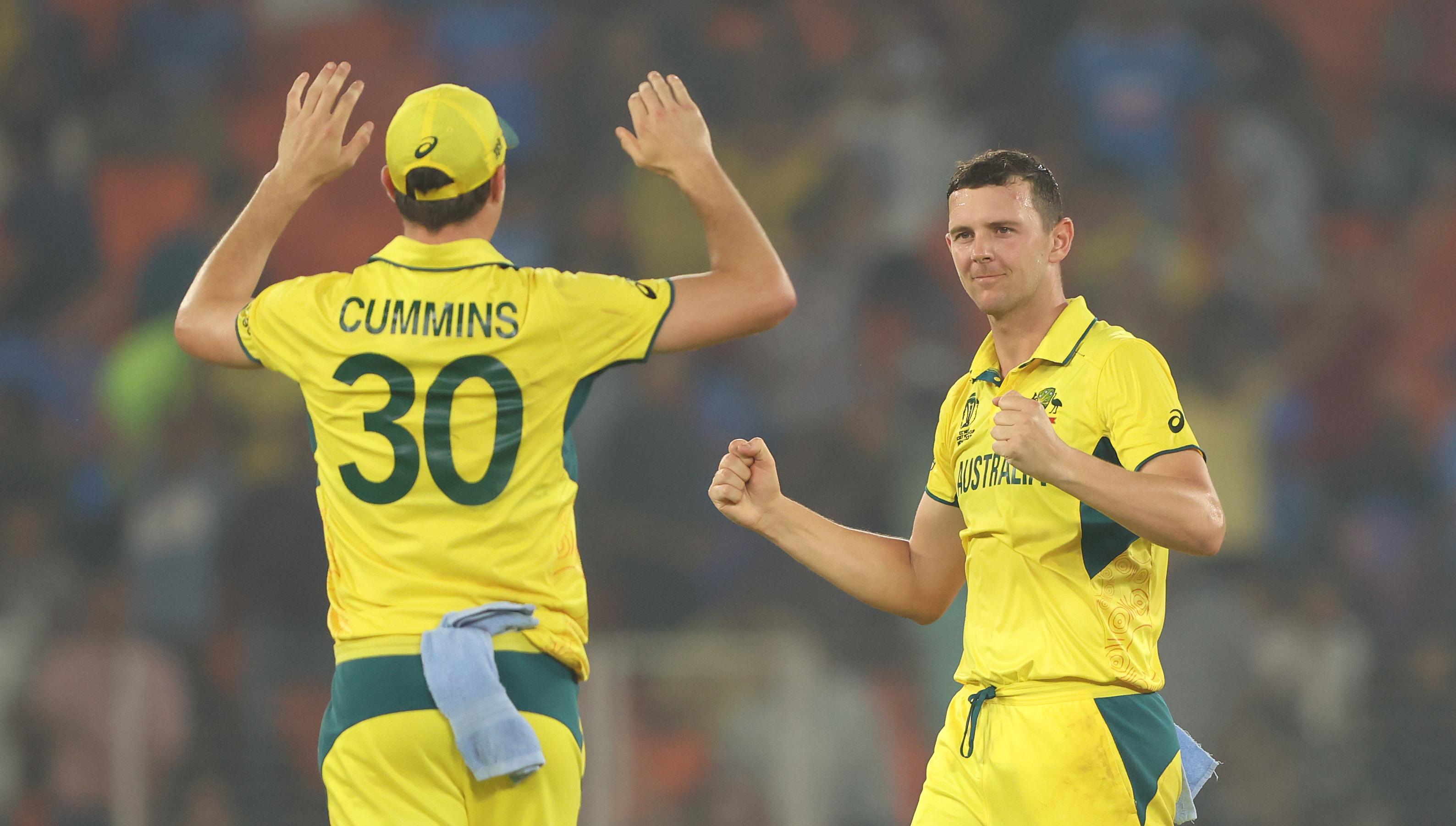 Josh Hazlewood and Pat Cummins in action.
