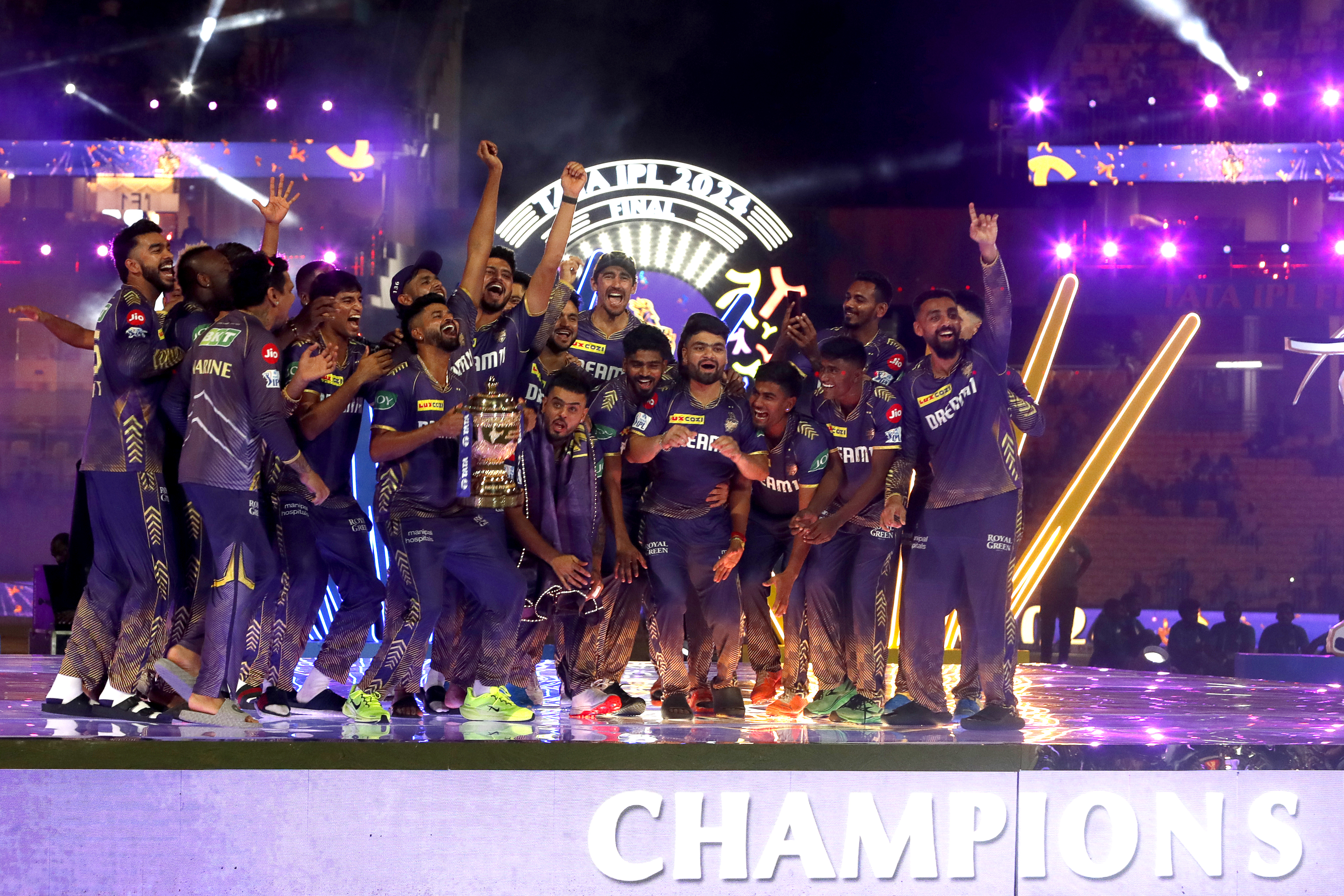 Players of Kolkata Knight Riders celebrate with the trophy.