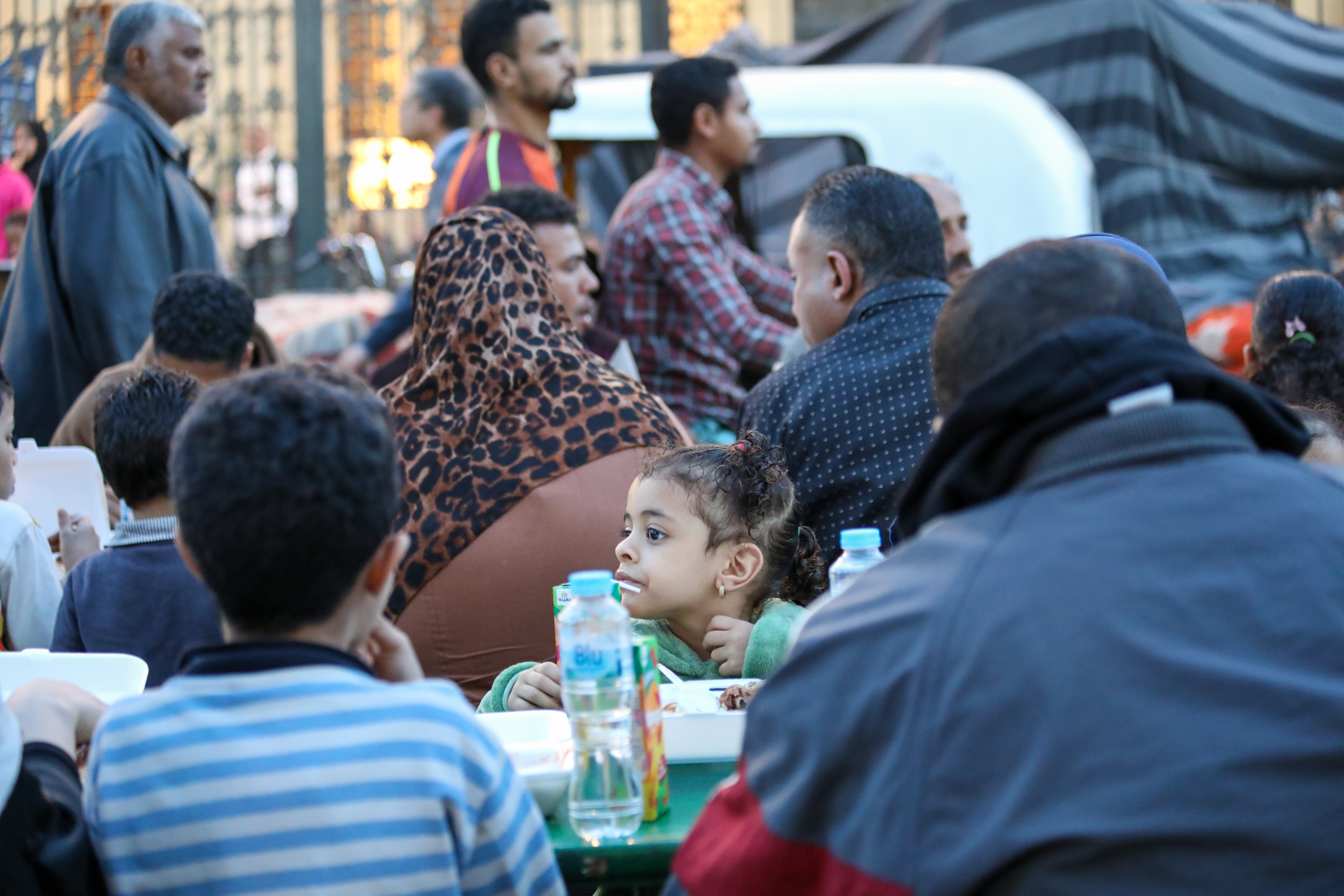 People sat a table waiting to eat