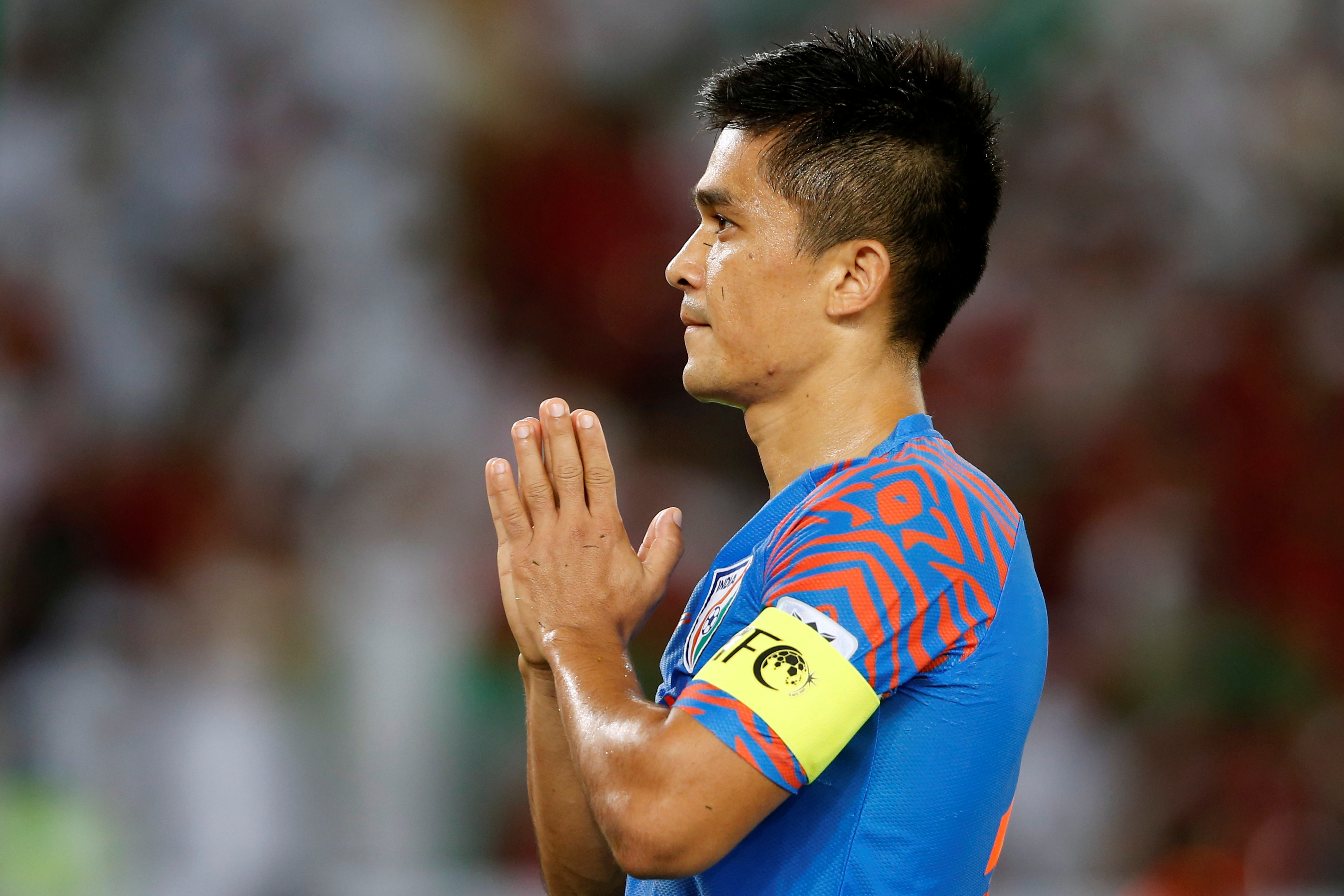 India's Sunil Chhetri clasps his hands together on the field.