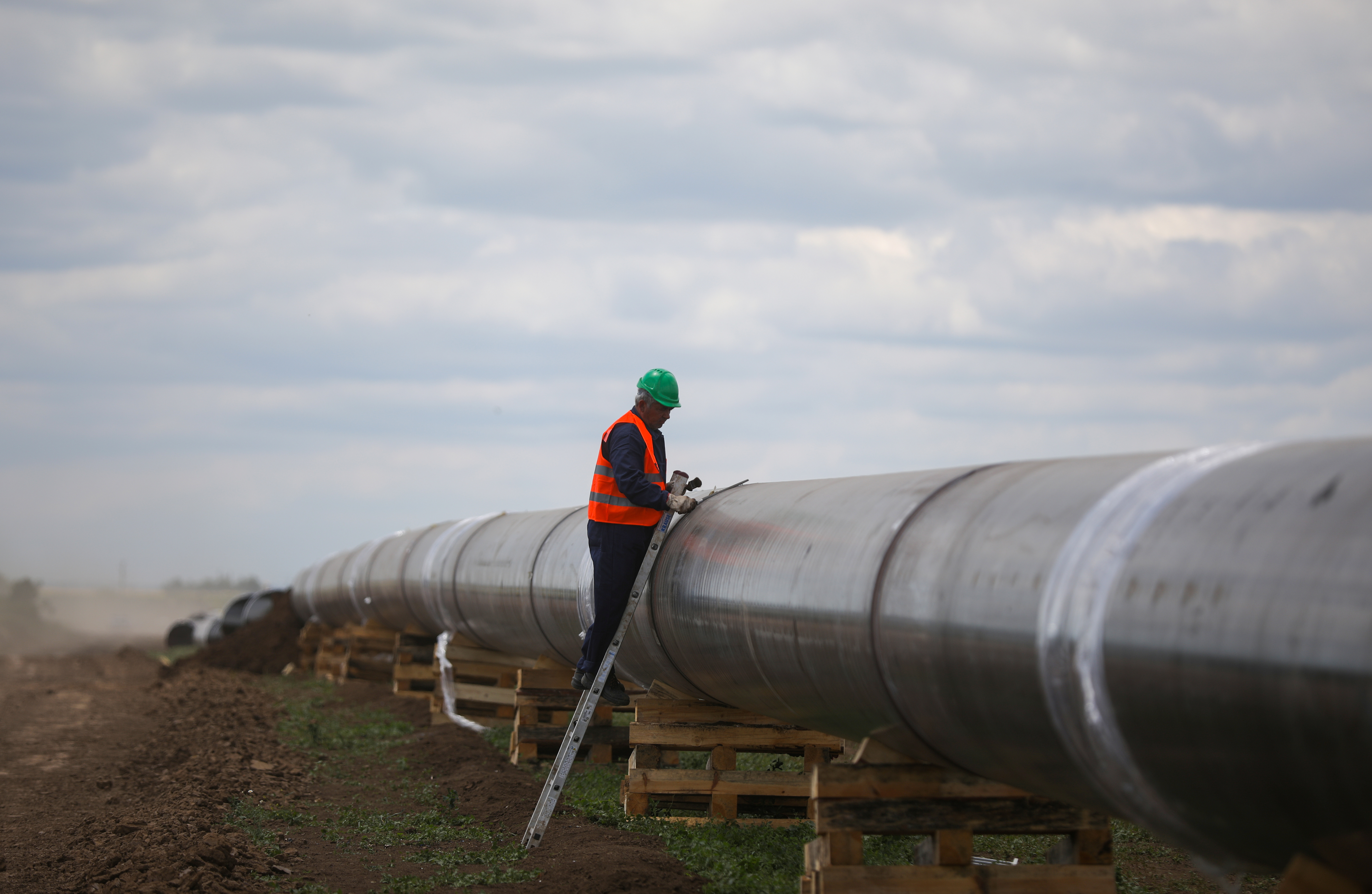 A worker is seen next to a pipe at a construction site on the extension of Russia's TurkStream gas pipeline after a visit of Serbia's President Aleksandar Vucic and Bulgaria's Prime Minister Boyko Borissov, in Letnitsa, Bulgaria, June 1, 2020. REUTERS/ Stoyan Nenov