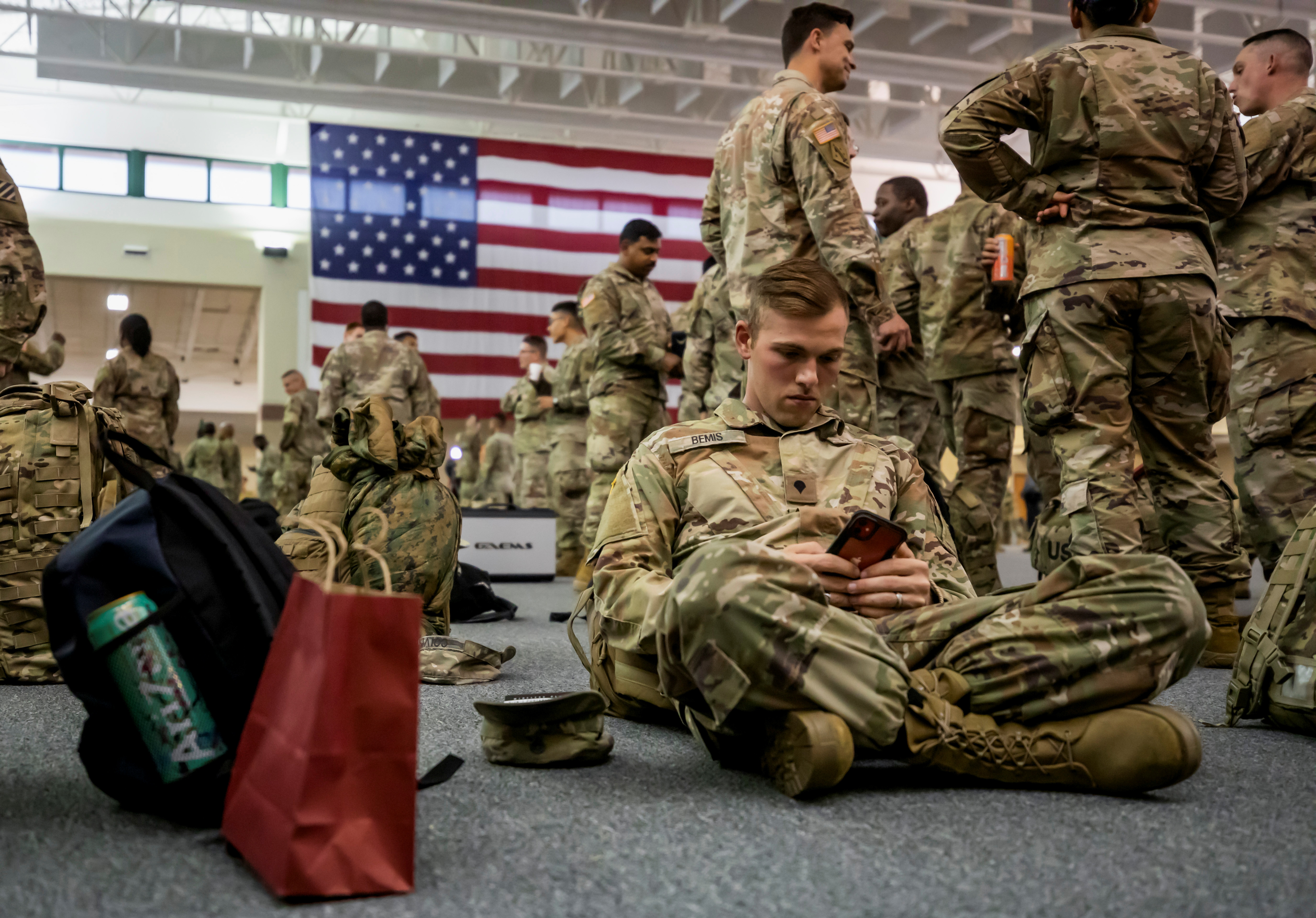 U.S. Army soldiers from B Company, of the Division Sustainment Support Battalion, 3rd Division Sustainment Brigade, wait in a staging area before boarding a transport plane bound for Europe on a deployment launched in response to the invasion of Ukraine by Russia, at Hunter Army Airfield in Savannah, Georgia, U.S., March 11, 2022. REUTERS/Sam Wolfe