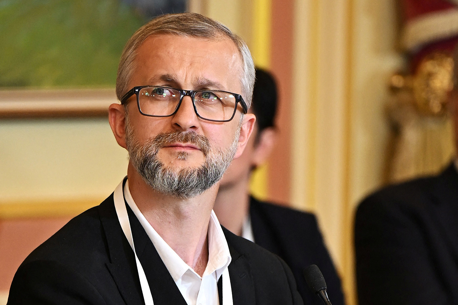 Deputy Chairman of the Mejlis of the Crimean Tatar Nariman Dzhelyal listens during a meeting.