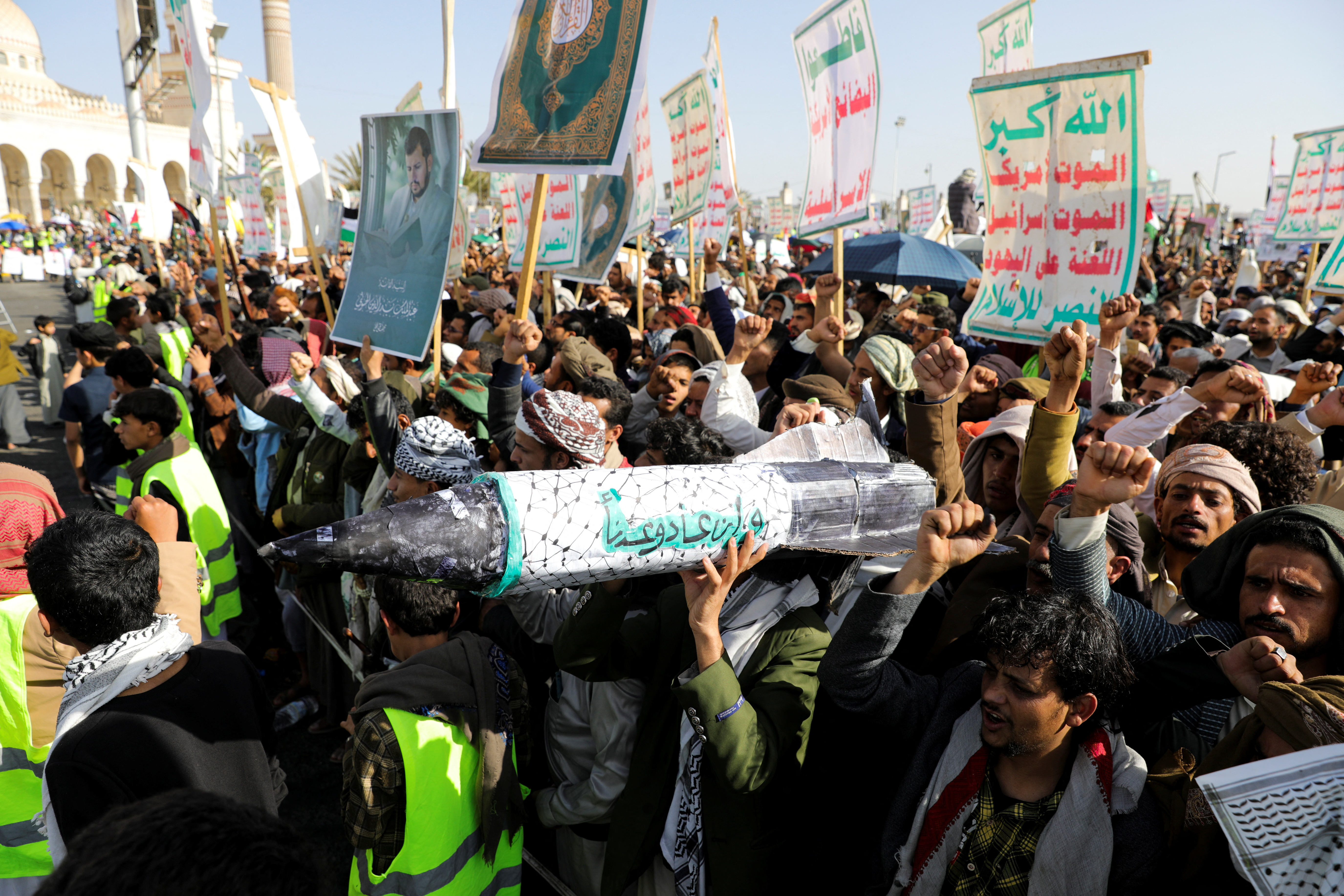 Protesters, predominantly Houthi supporters, hold a mock missile as they demonstrate in solidarity with the Palestinians in the Gaza Strip, in Sanaa, Yemen February 14, 2025