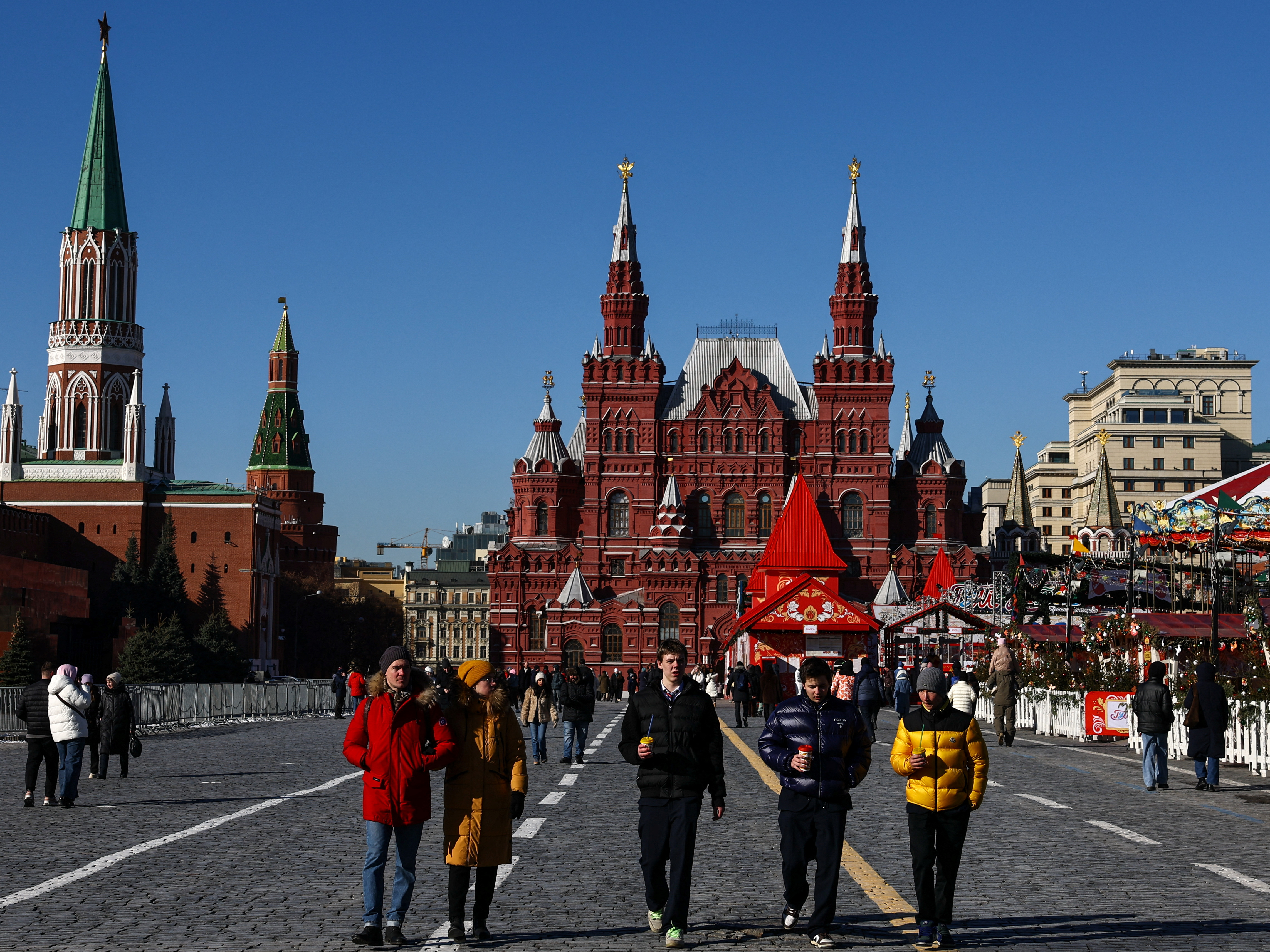 People walk in Red Square on a sunny day in central Moscow, Russia, February 24, 2025. REUTERS/Evgenia Novozhenina