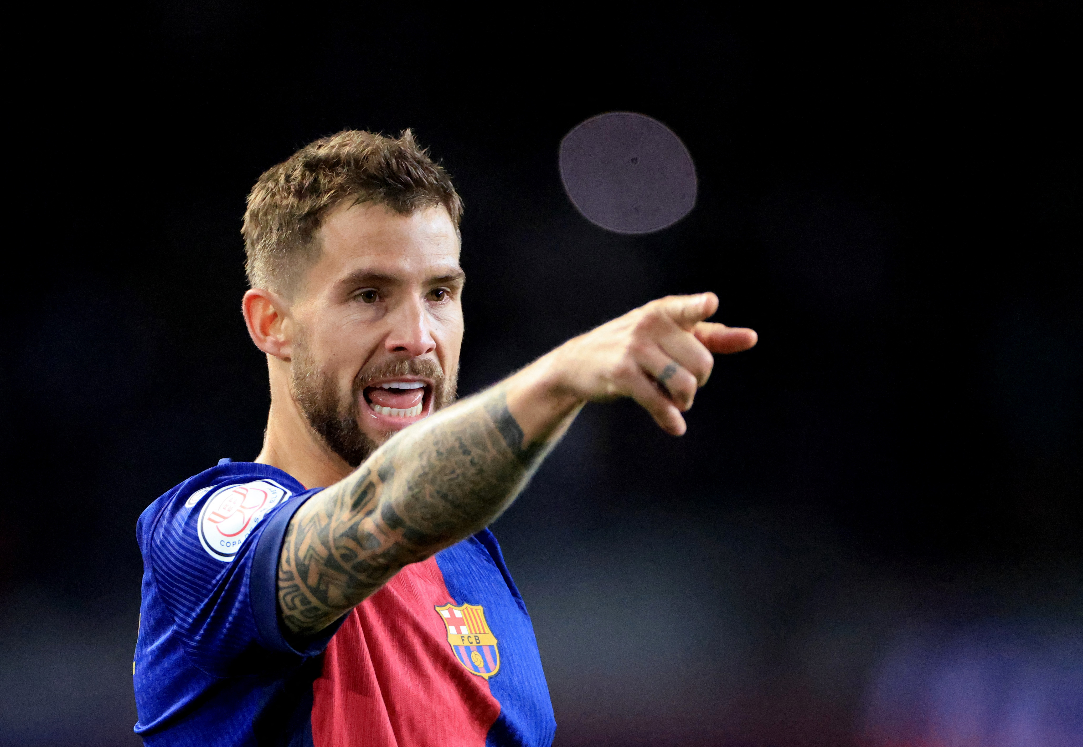 Soccer Football - Copa del Rey - Semi Final - First Leg - FC Barcelona v Atletico Madrid - Estadi Olimpic Lluis Companys, Barcelona, Spain - February 25, 2025 FC Barcelona's Inigo Martinez reacts after scoring their third goal REUTERS/Nacho Doce