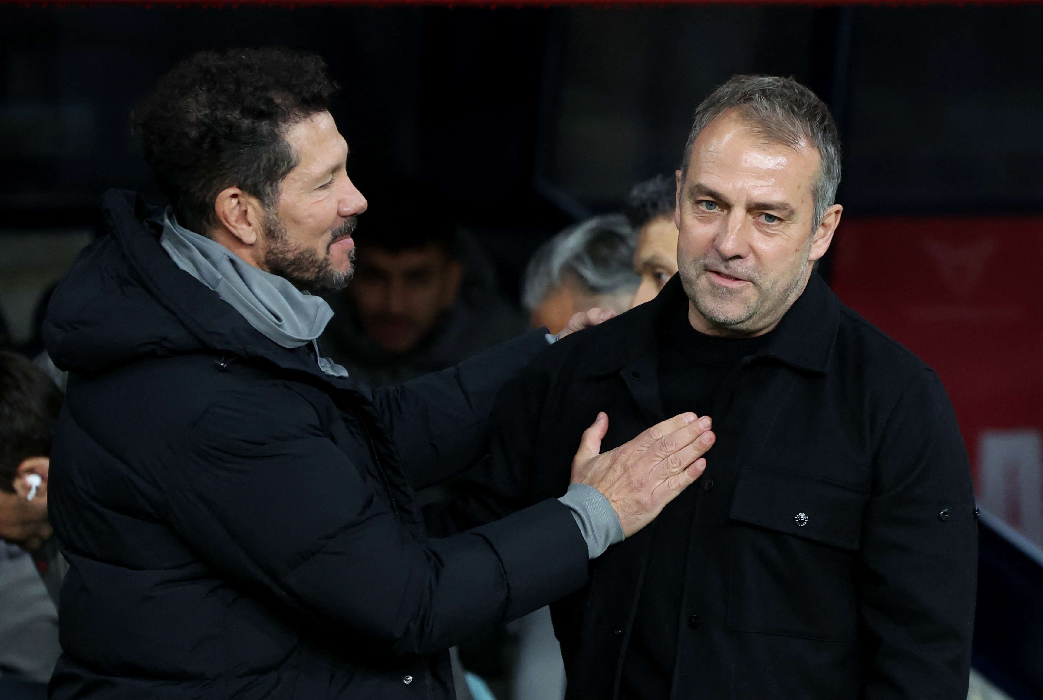 Soccer Football - Copa del Rey - Semi Final - First Leg - FC Barcelona v Atletico Madrid - Estadi Olimpic Lluis Companys, Barcelona, Spain - February 25, 2025 FC Barcelona coach Hansi Flick with Atletico Madrid coach Diego Simeone before the match REUTERS/Nacho Doce