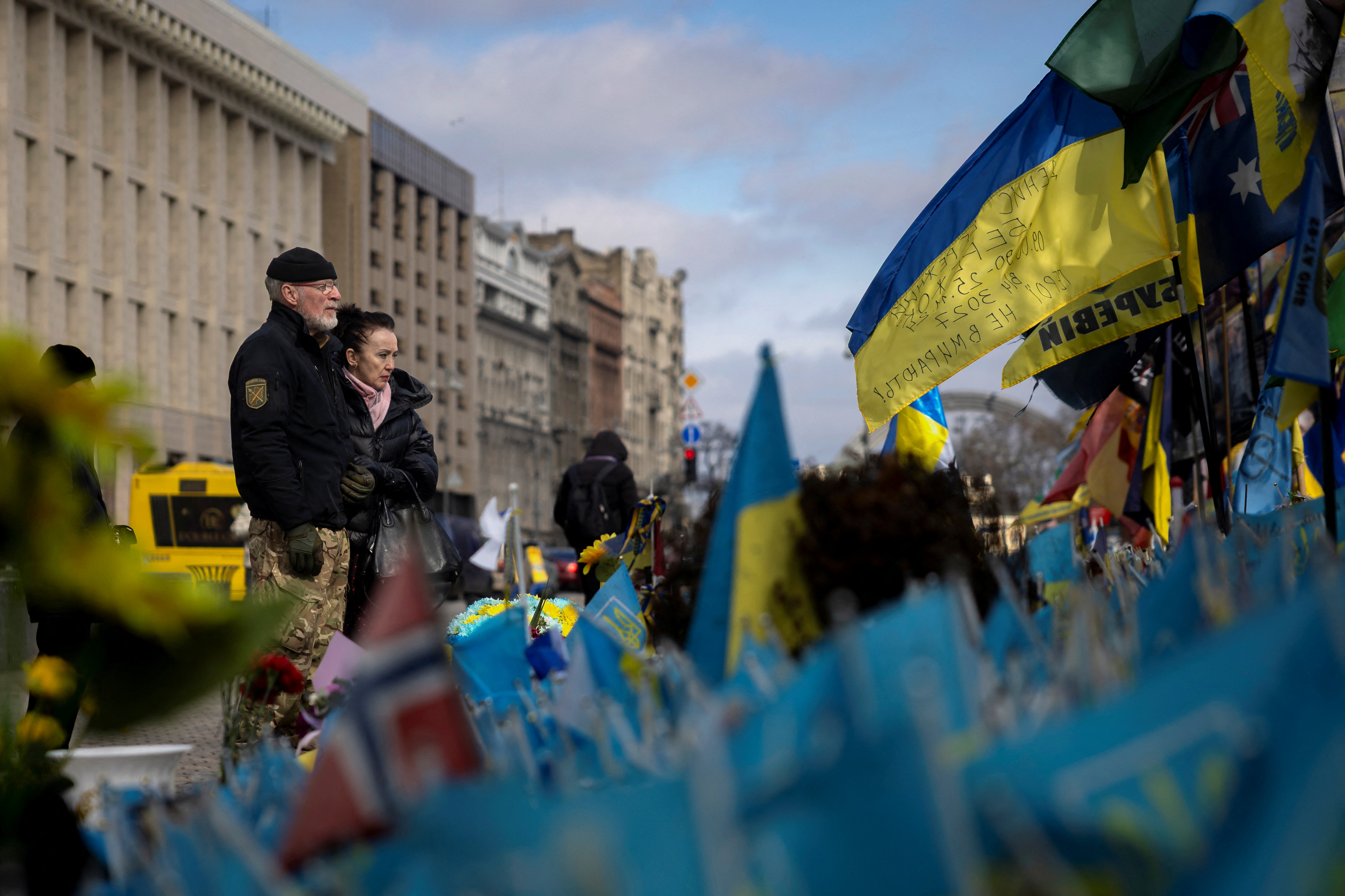 People at a memorial for fallen soldiers at Independence Square in Kyiv