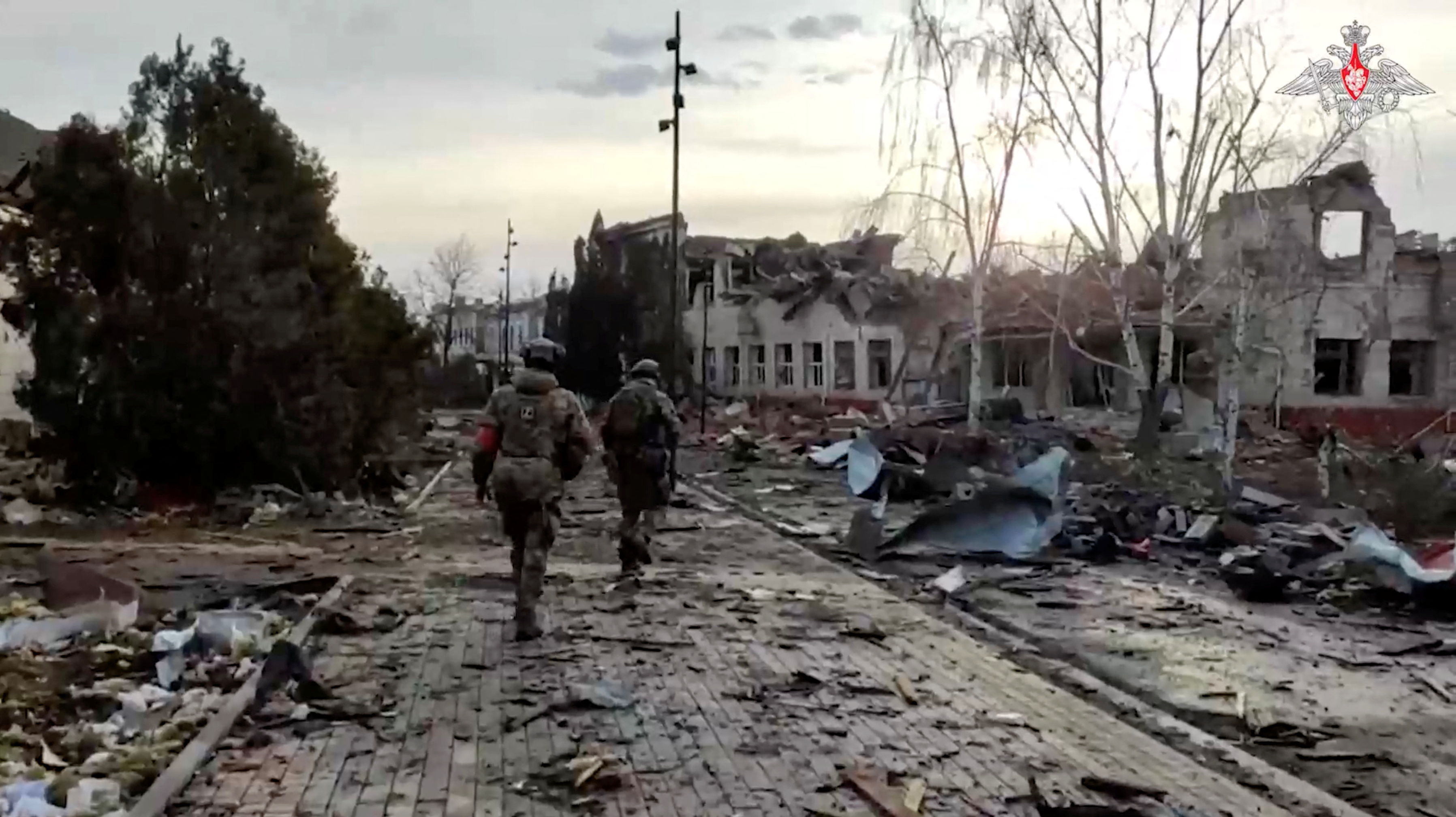 Russian service members walk past a destroyed building in the town of Sudzha, which was recently retaken by Russia's armed forces in the course of Russia-Ukraine conflict in the Kursk region, Russia, in this still image from video released March 15, 2025. Russian Defence Ministry/Handout via REUTERS ATTENTION EDITORS - THIS IMAGE HAS BEEN SUPPLIED BY A THIRD PARTY. NO RESALES. NO ARCHIVES. MANDATORY CREDIT.