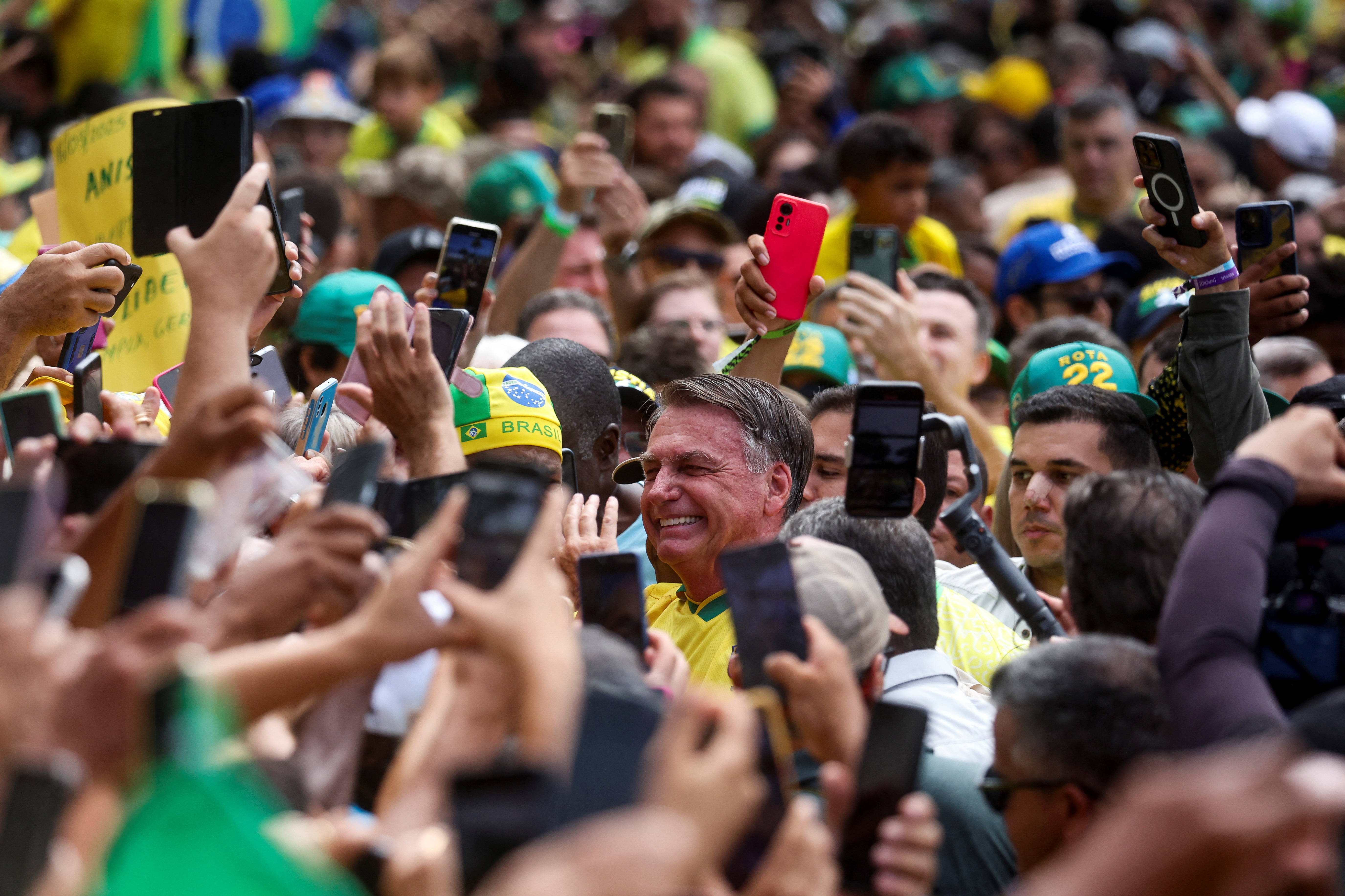 Supporters gather around former Brazilian President Jair Bolsonaro at Copacabana beach, in Rio de Janeiro, Brazil, March 16, 2025. REUTERS/Pilar Olivares