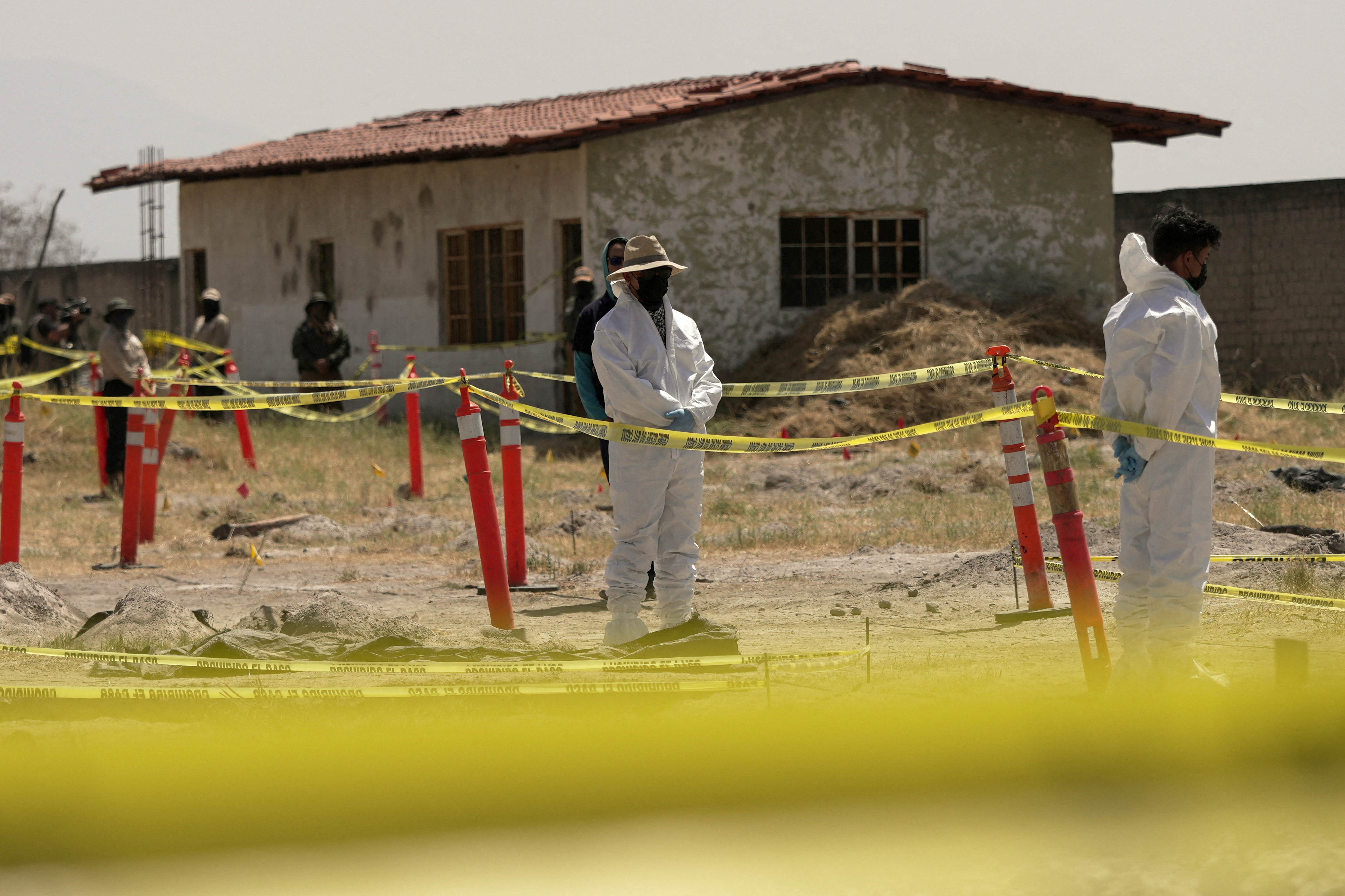 Forensic technicians examine a mass grave site in Teuchitlan, Jalisco, on March 20 [Ivan Arias/Reuters]