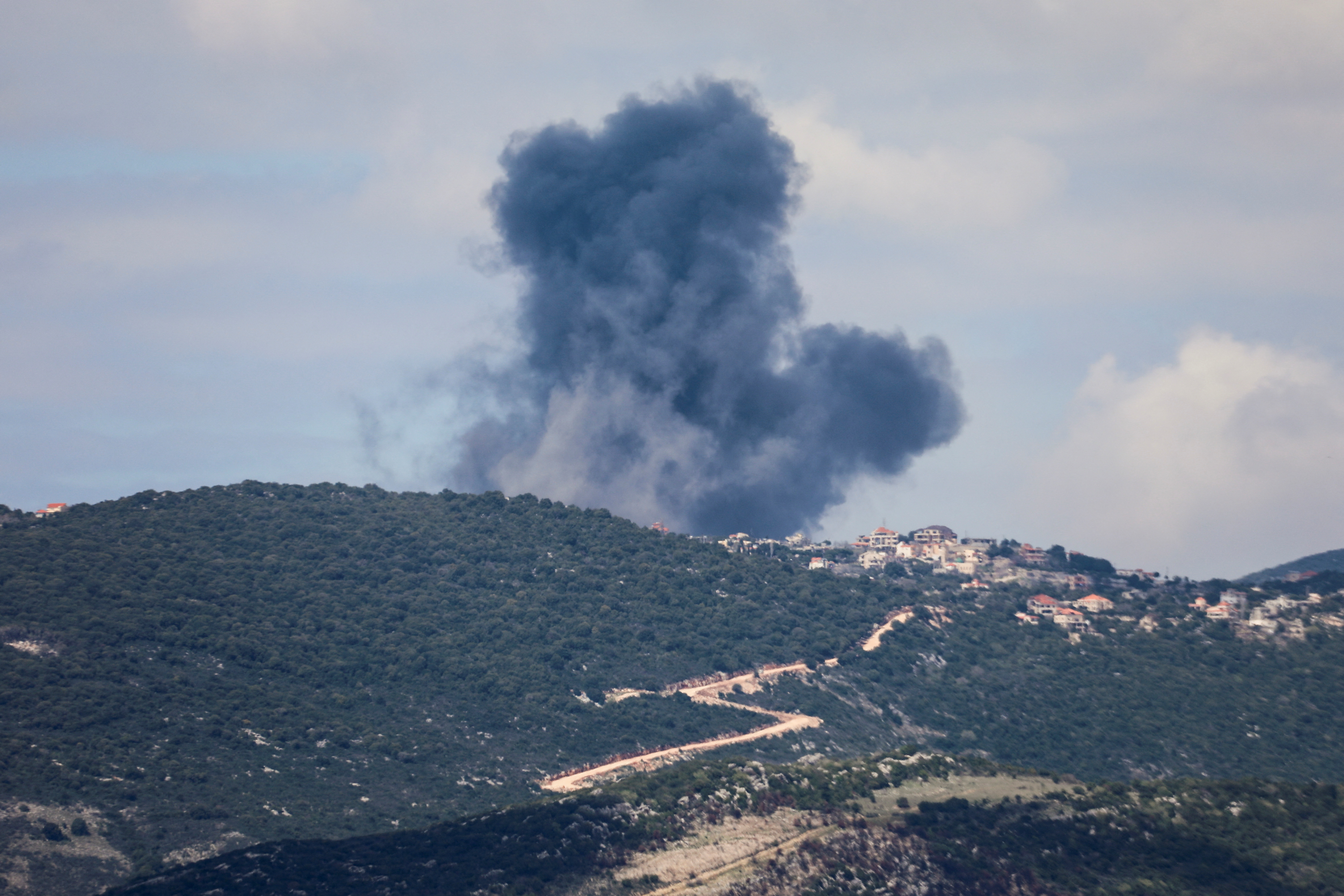 Smoke rises from Jabal al-Rihan, following Israeli strikes in response to cross-border rocket fire, as seen from Marjayoun, in southern Lebanon, March 22, 2025. [File: Karamallah Daher/Reuters] 