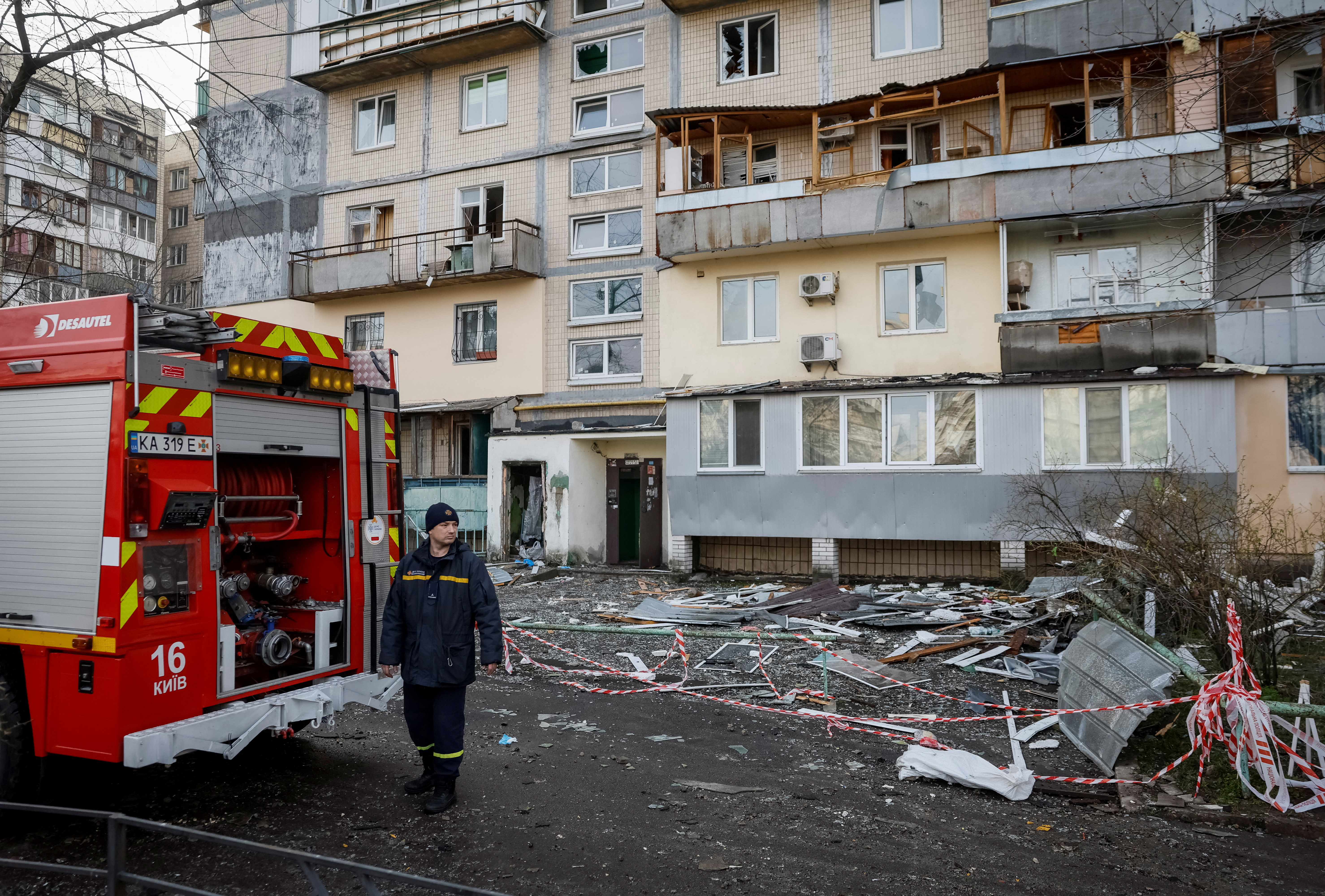 A firefighter at a site of an apartment building in Kyiv hit by a drone attack.