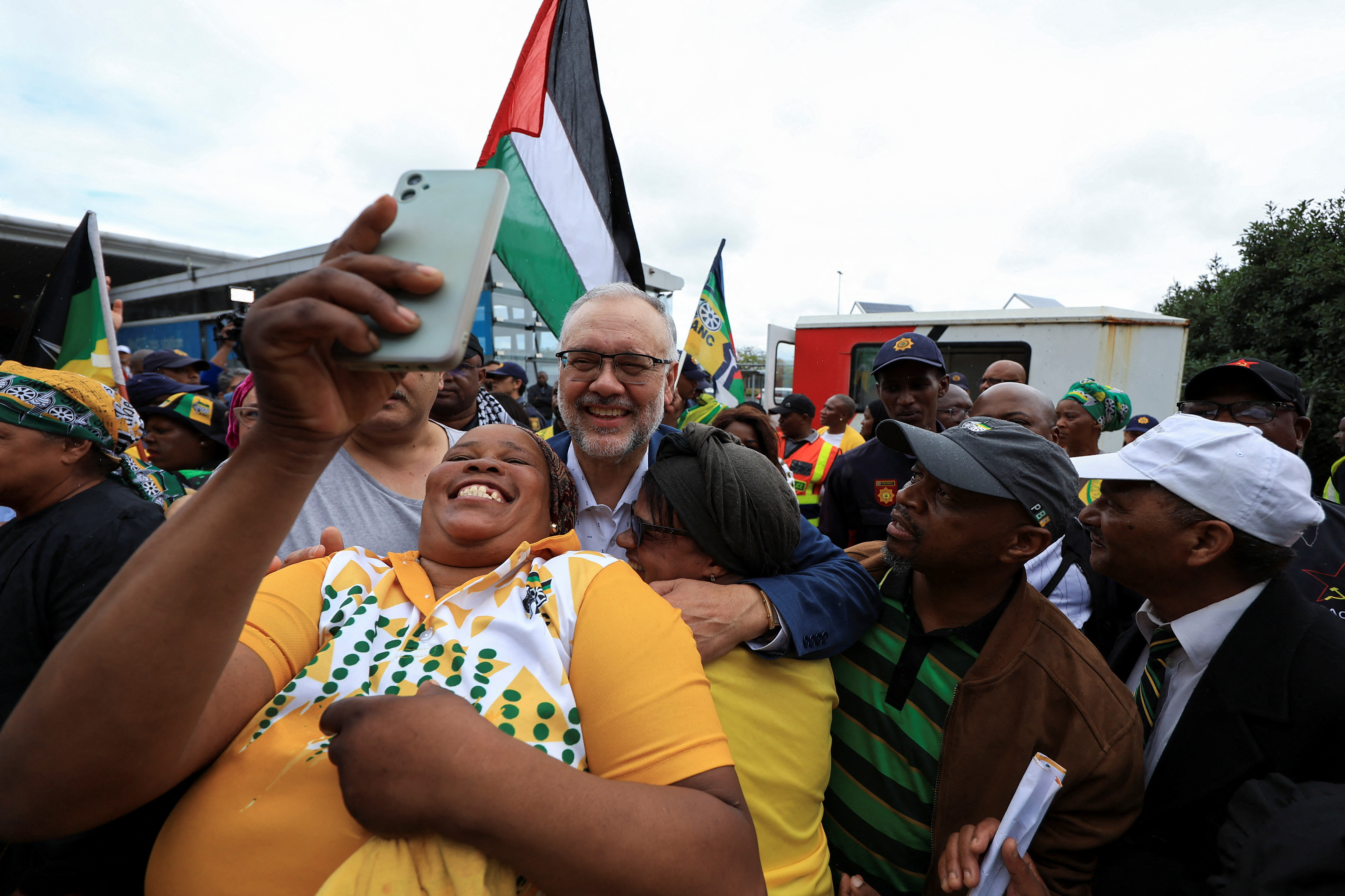 South Africa's expelled ambassador to the United States Ebrahim Rasool is greeted upon his arrival at Cape Town International Airport, in Cape Town, South Africa, March 23, 2025. REUTERS/Esa Alexander