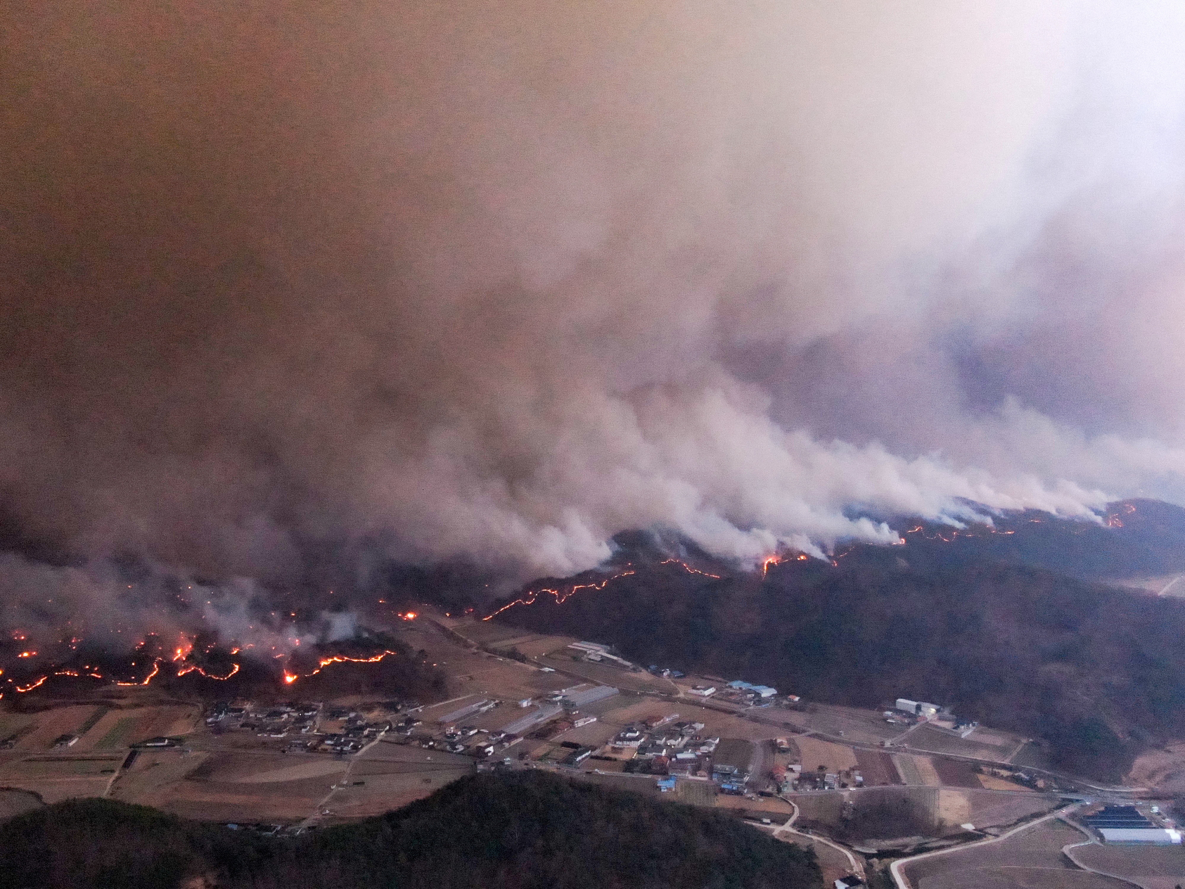 Smoke rises from a wildfire that devastates the area, in Andong, South Korea, March 25, 2025. Yonhap via REUTERS THIS IMAGE HAS BEEN SUPPLIED BY A THIRD PARTY. NO RESALES. NO ARCHIVES. SOUTH KOREA OUT. NO COMMERCIAL OR EDITORIAL SALES IN SOUTH KOREA.