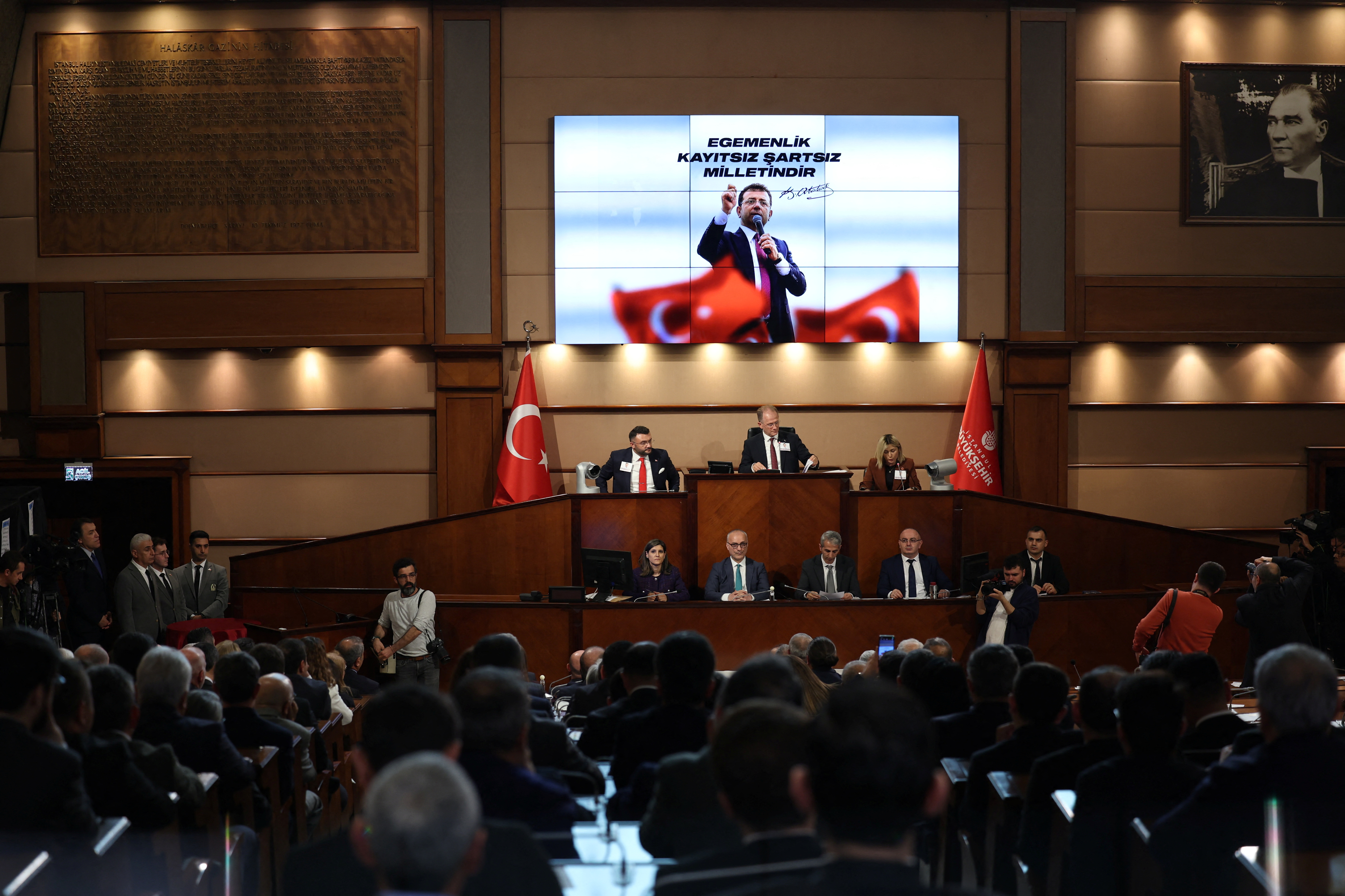 A digital bilboard displays a picture of Istanbul Mayor Ekrem Imamoglu during a municipal council to elect an interim mayo