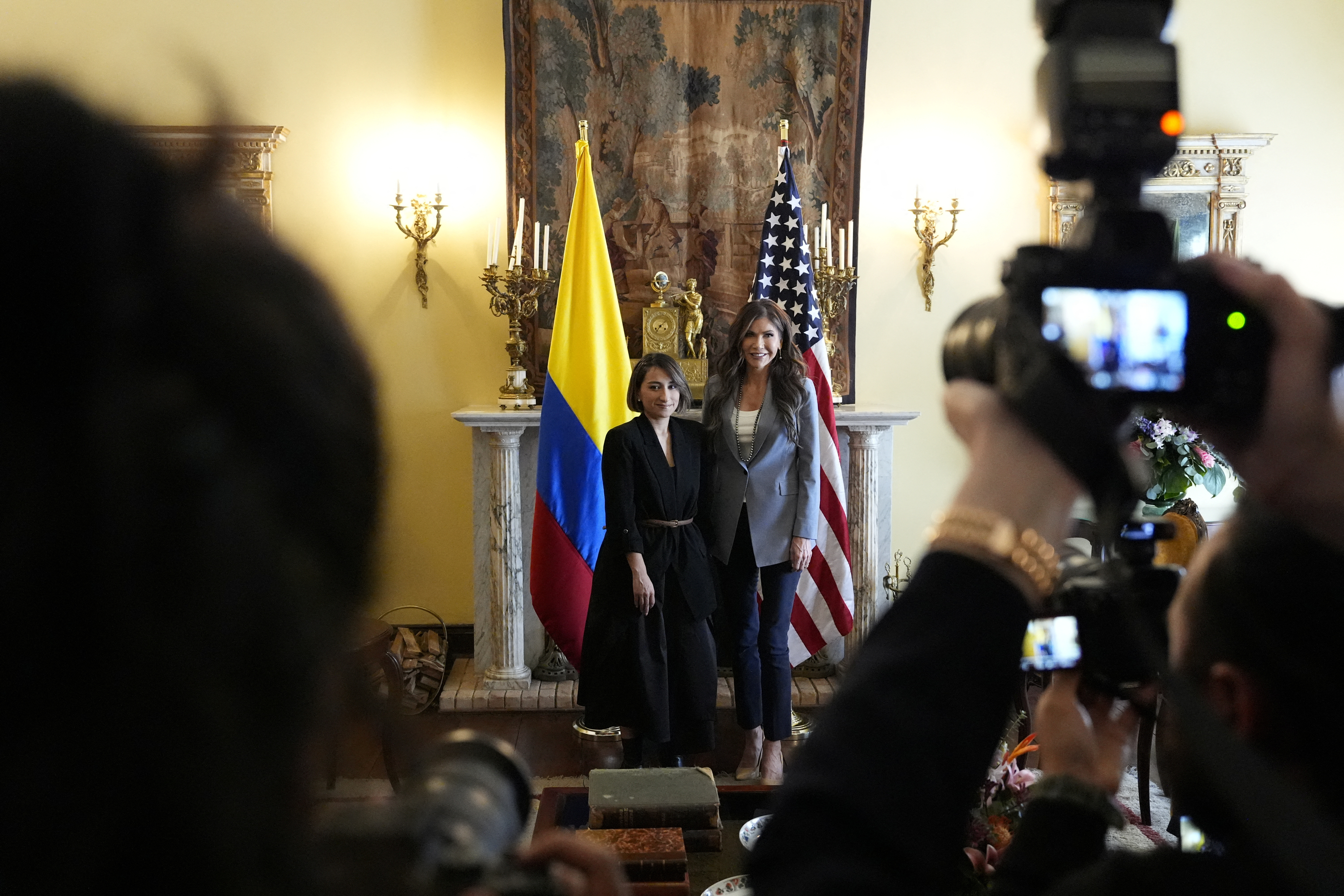 Laura Sarabia and Kristi Noem at a press conference in Bogota