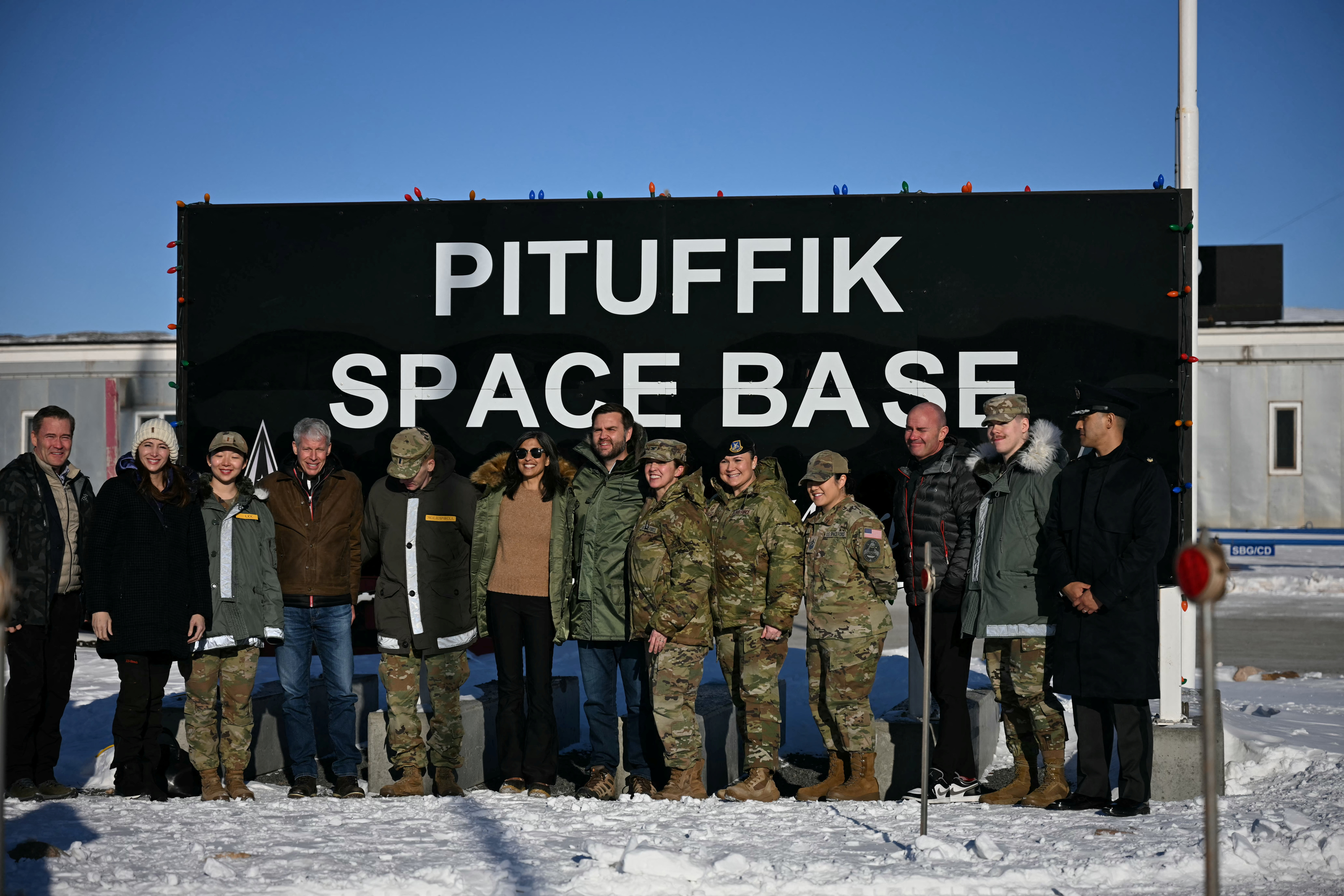 U.S. Vice President JD Vance and second lady Usha Vance pose with personnel at the US military's Pituffik Space Base in Greenland on March 28, 2025. Jim Watson/Pool via REUTERS