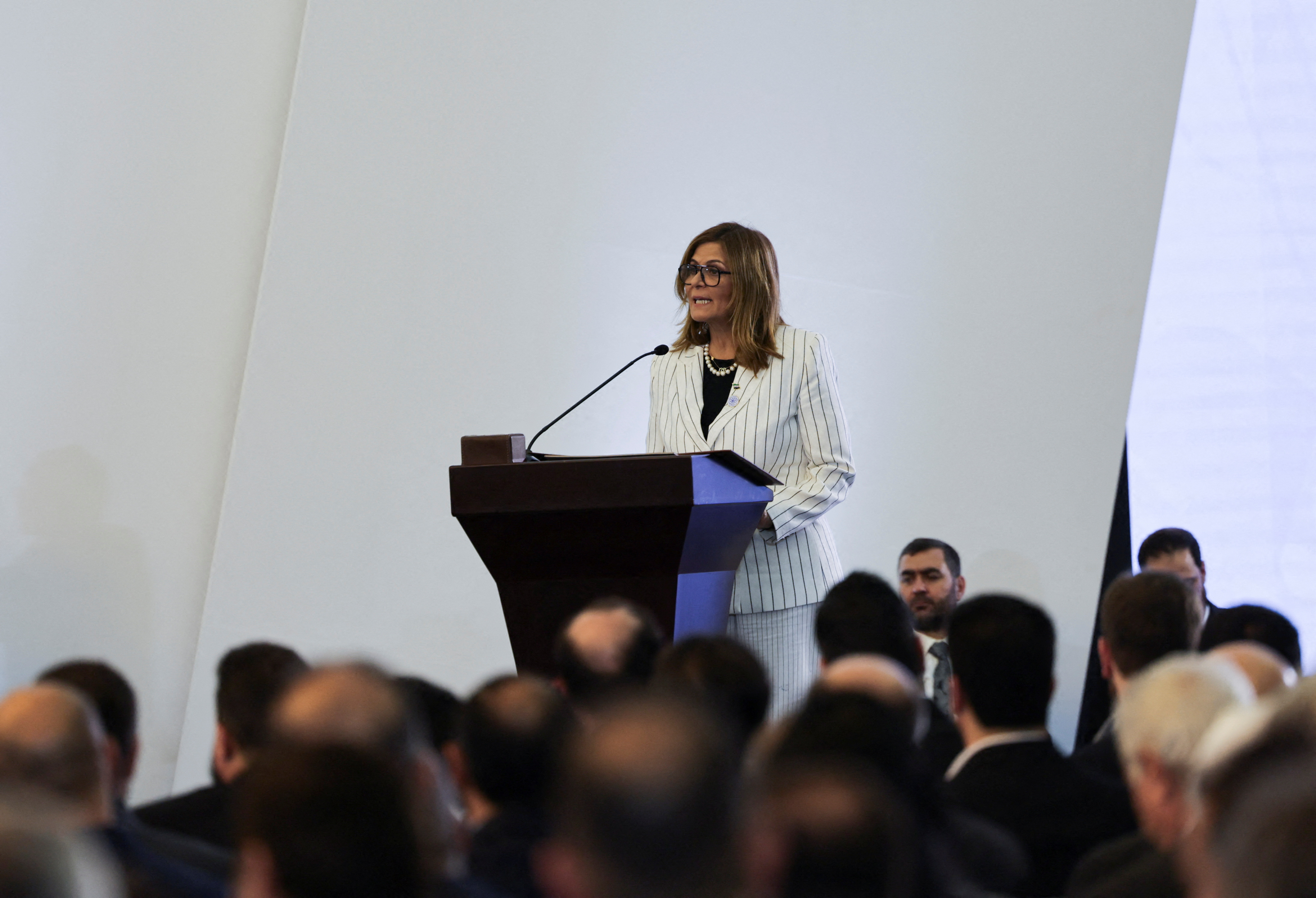 Newly appointed Minister of Social Affairs and Labour Hind Kabawat speaks during a Ministerial formation of the government of the Syrian Arab Republic
