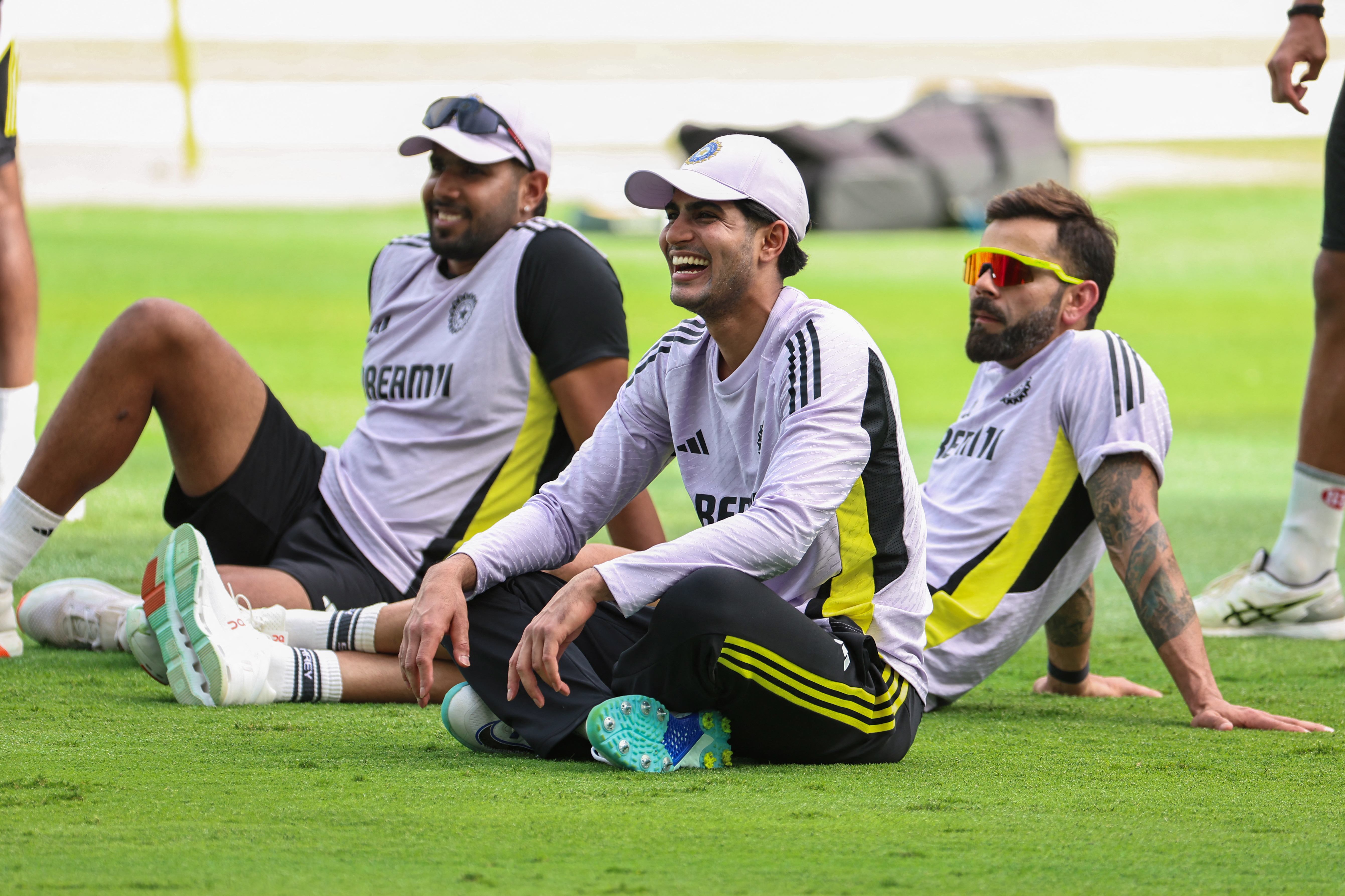 India's Shubman Gill (C) and Virat Kohli (R) join the team during a practice secisson a day ahead of the ICC Champions Trophy one-day international (ODI) cricket final match between India and New Zealand at Dubai International Stadium in Dubai on March 8, 2025. (Photo by FADEL SENNA / AFP)