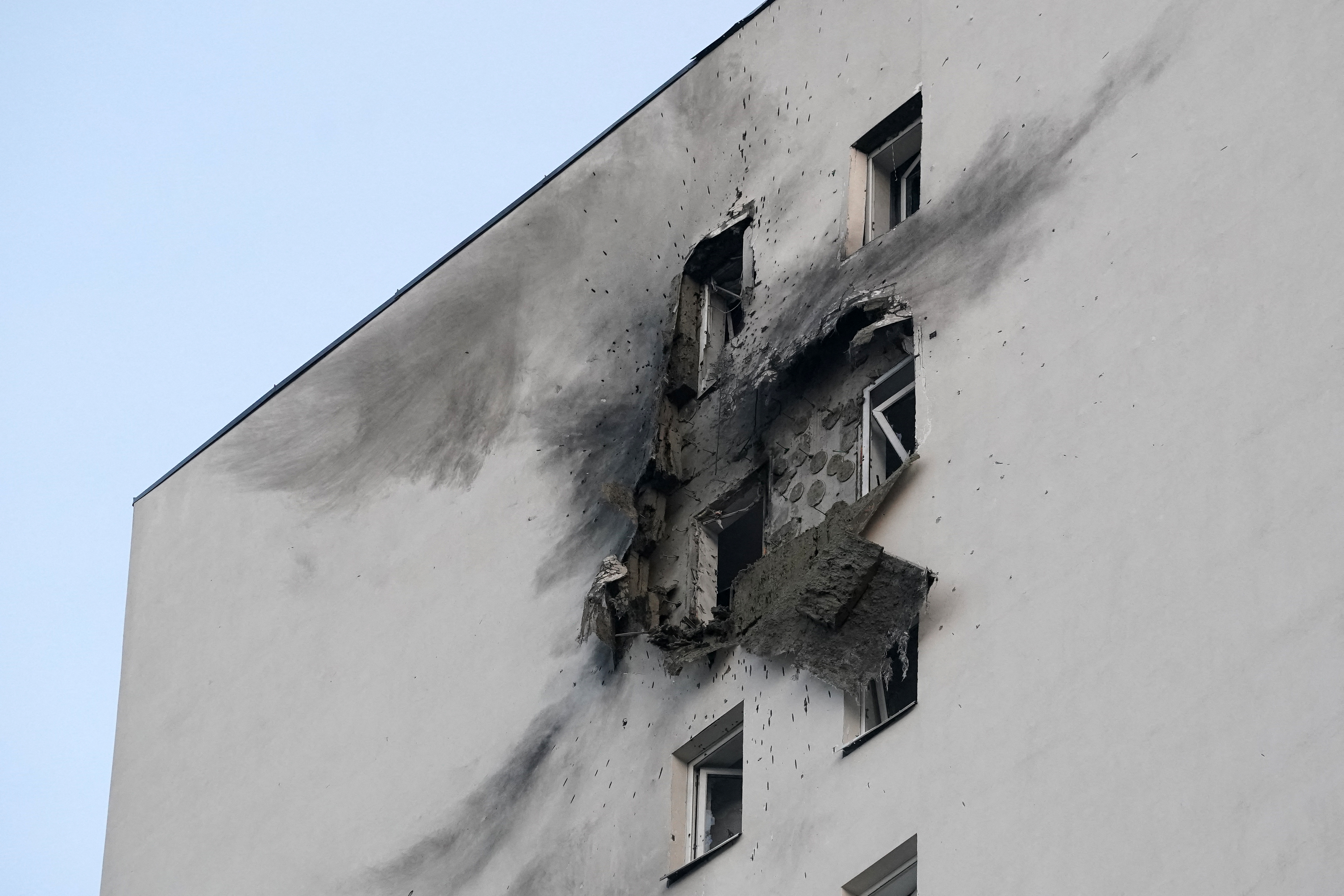 A view shows a damaged apartment building in a residential complex following a drone attack in the village of Sapronovo in the Moscow region on March 11, 2025. Ukraine targeted Moscow with dozens of drones in a "massive" overnight attack, the city's mayor said on March 11, 2025. (Photo by TATYANA MAKEYEVA / AFP)