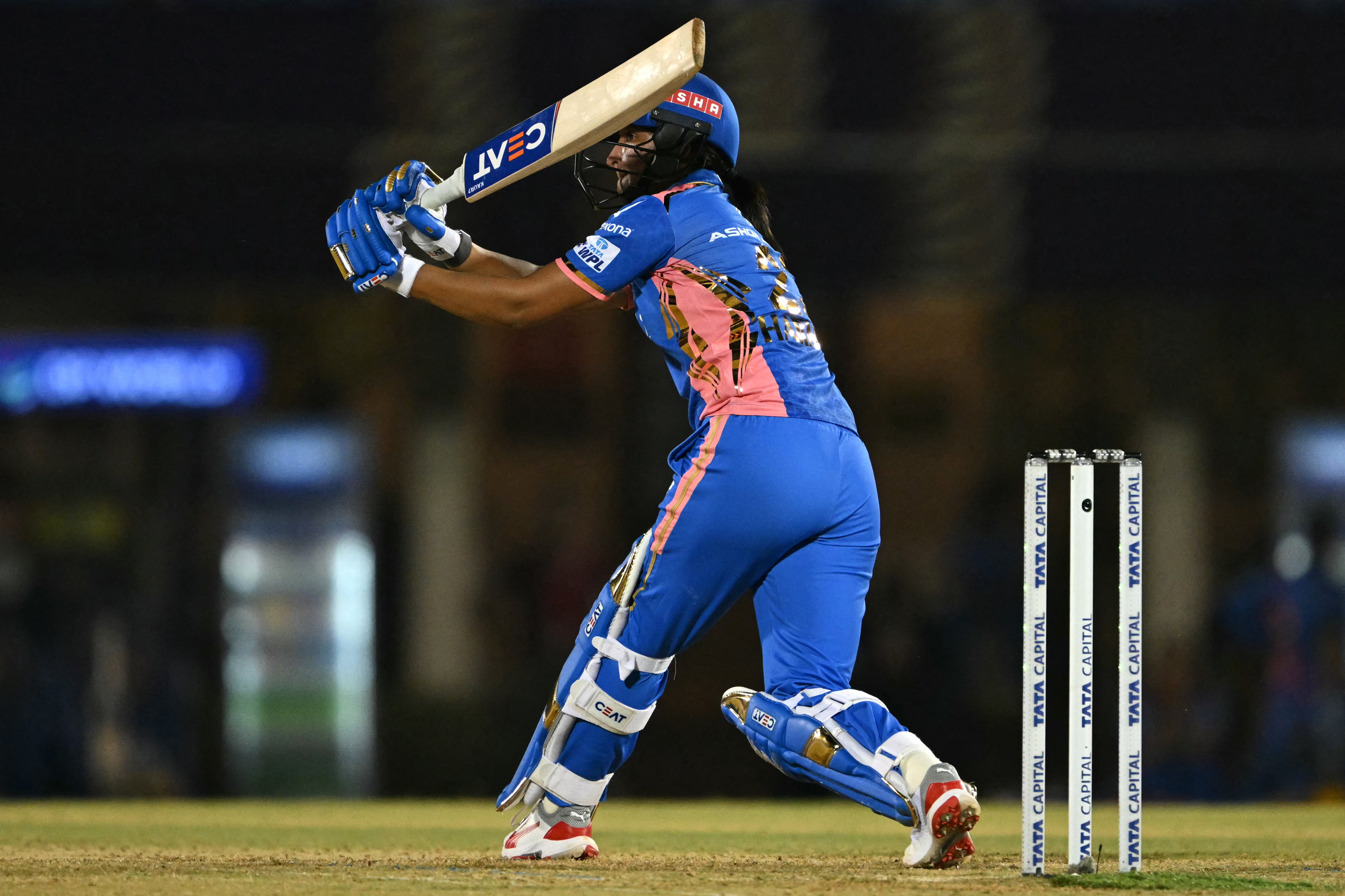 Mumbai Indians' captain Harmanpreet Kaur plays a shot during the Women's Premier League (WPL) Twenty20 final cricket match between Mumbai Indians and Delhi Capitals at Brabourne Stadium in Mumbai on March 15, 2025. (Photo by INDRANIL MUKHERJEE / AFP) / -- IMAGE RESTRICTED TO EDITORIAL USE - STRICTLY NO COMMERCIAL USE --