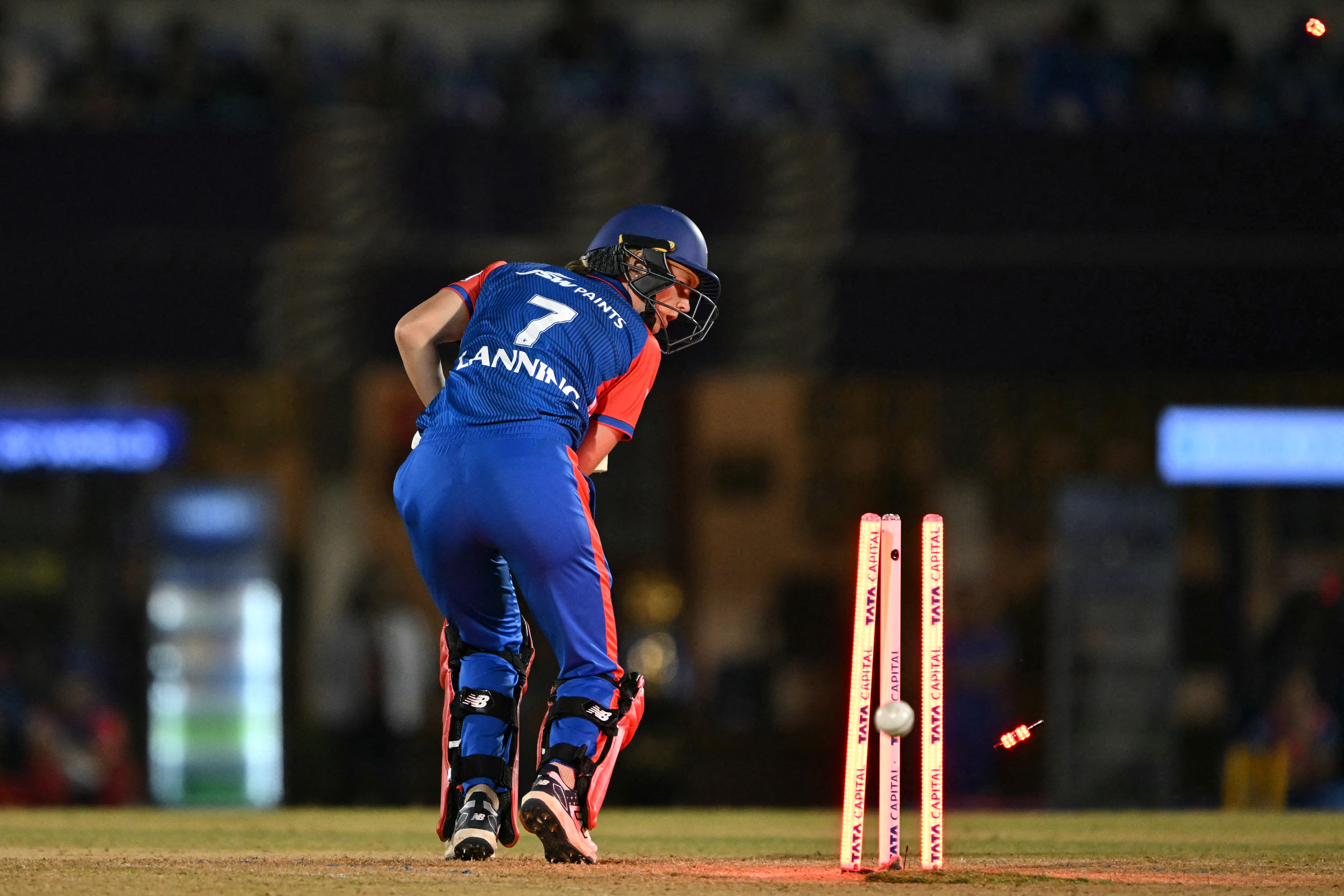 Delhi Capitals' captain Meg Lanning is clean bowled by Mumbai Indians' Nat Sciver-Brunt during the Women's Premier League (WPL) Twenty20 final cricket match between Mumbai Indians and Delhi Capitals at Brabourne Stadium in Mumbai on March 15, 2025. (Photo by INDRANIL MUKHERJEE / AFP) / -- IMAGE RESTRICTED TO EDITORIAL USE - STRICTLY NO COMMERCIAL USE --