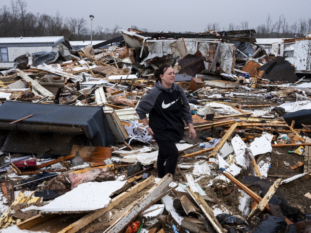POPLAR BLUFF, MISSOURI - MARCH 15: Stevie Kara searches for personal items after her home was destroyed on March 15, 2025 in Poplar Bluff, Missouri. Kara was at home when the storm came through and woke up on the ground needing stitches in her hand and leg. Many homes throughout Harmony Hills were damaged by the severe weather on Friday night that left one person dead in Butler County, Missouri. At least 19 people have reportedly been killed after tornadoes and severe storms hit several midwest and southern states overnight. Brad Vest/Getty Images/AFP (Photo by Brad Vest / GETTY IMAGES NORTH AMERICA / Getty Images via AFP)