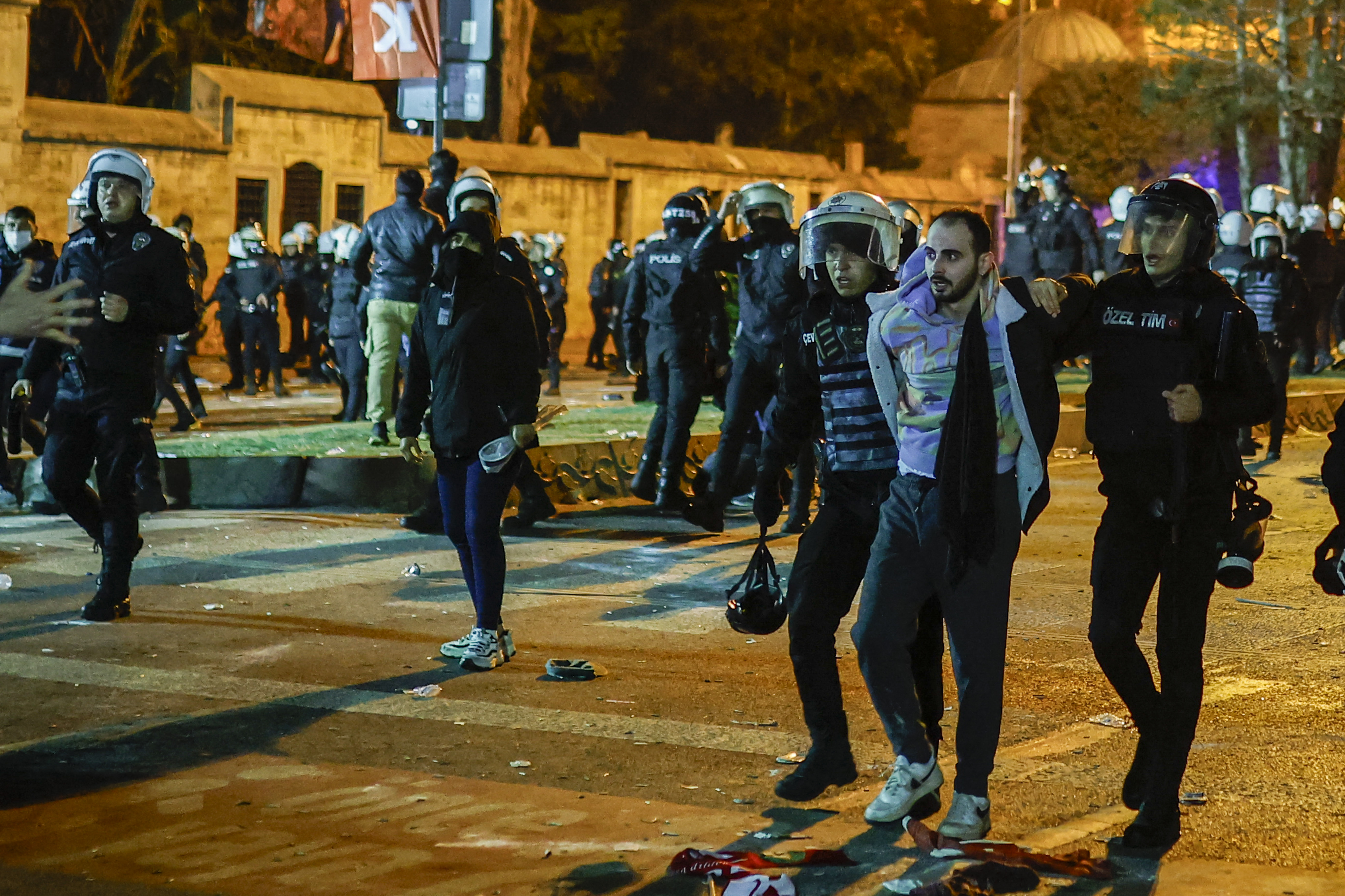 Turkish police officers try to detain a protester during a rally in support of arrested Istanbul’s mayor Ekrem Imamoglu, in Istanbul on March 23, 2025. Istanbul's newly-deposed mayor Ekrem Imamoglu was taken to a jail on the western outskirts of the megacity city on March 23, 2025 afternoon, the main CHP opposition party said. (Photo by KEMAL ASLAN / AFP)