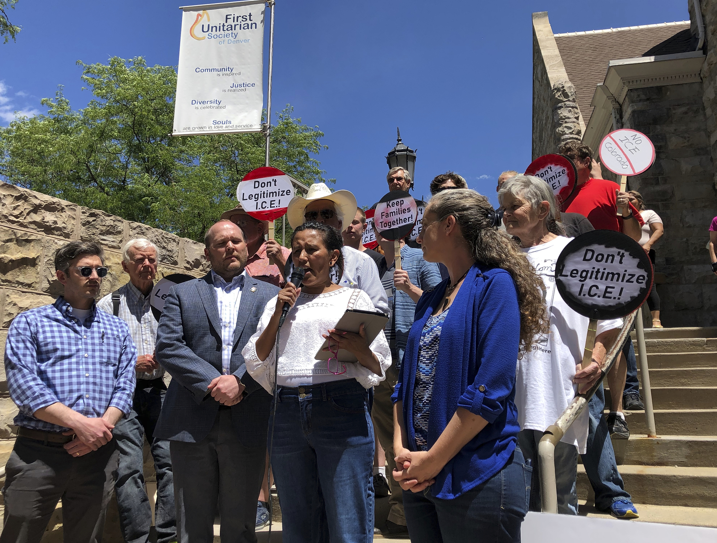 Jeanette Vizguerra, an immigration activist who has fought deportation to Mexico, surrounded by supporters, speaks outside the Denver church where she has sought sanctuary in Denver, Colo., Thursday, June 19, 2019. Vizguerra says federal authorities have denied her latest petition to stay in the U.S. She will continue her fight while living in the First Unitarian Society of Denver church to avoid deportation to her native Mexico. Vizguerra has lived in the United States since 1997. She has three U.S.-born children. Her attorney says he's appealing the decision.
