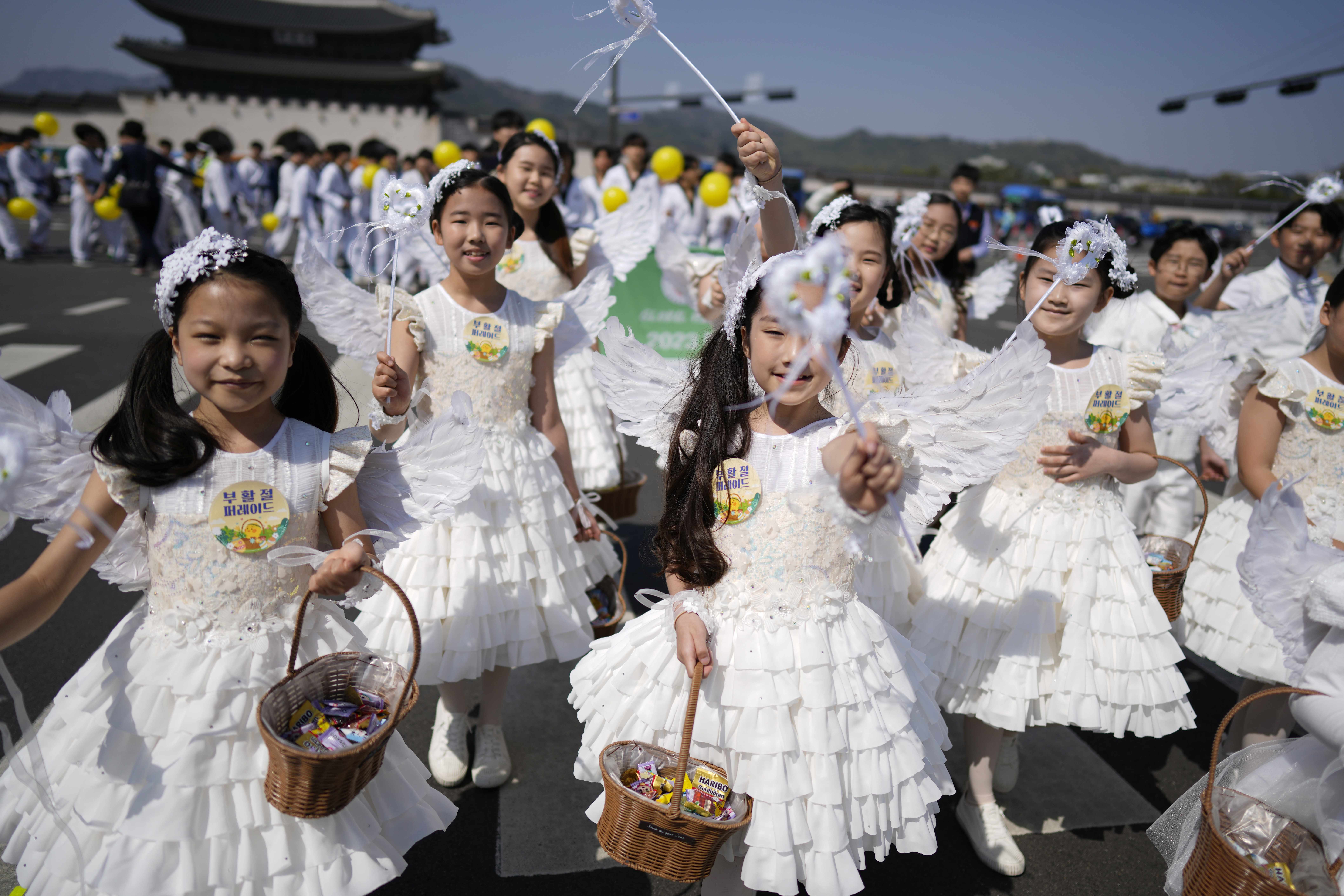 Children take part in an Easter parade in Seoul, South Korea, on April 9, 2023. The birthrate for South Korea has risen for the first time since 2015 [Lee Jin-man/AP]
