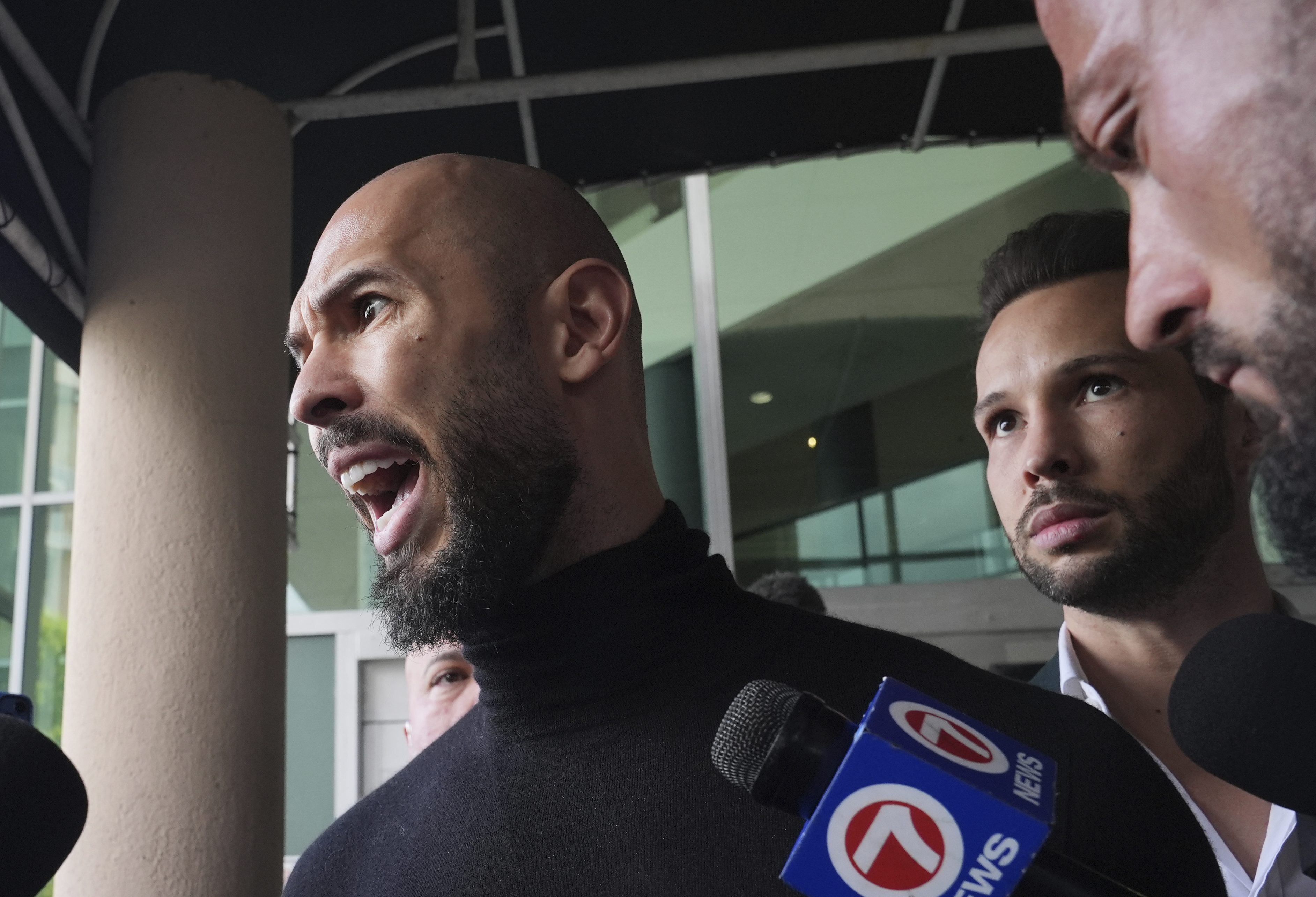 Andrew and Tristan Tate speak to reporters in Florida