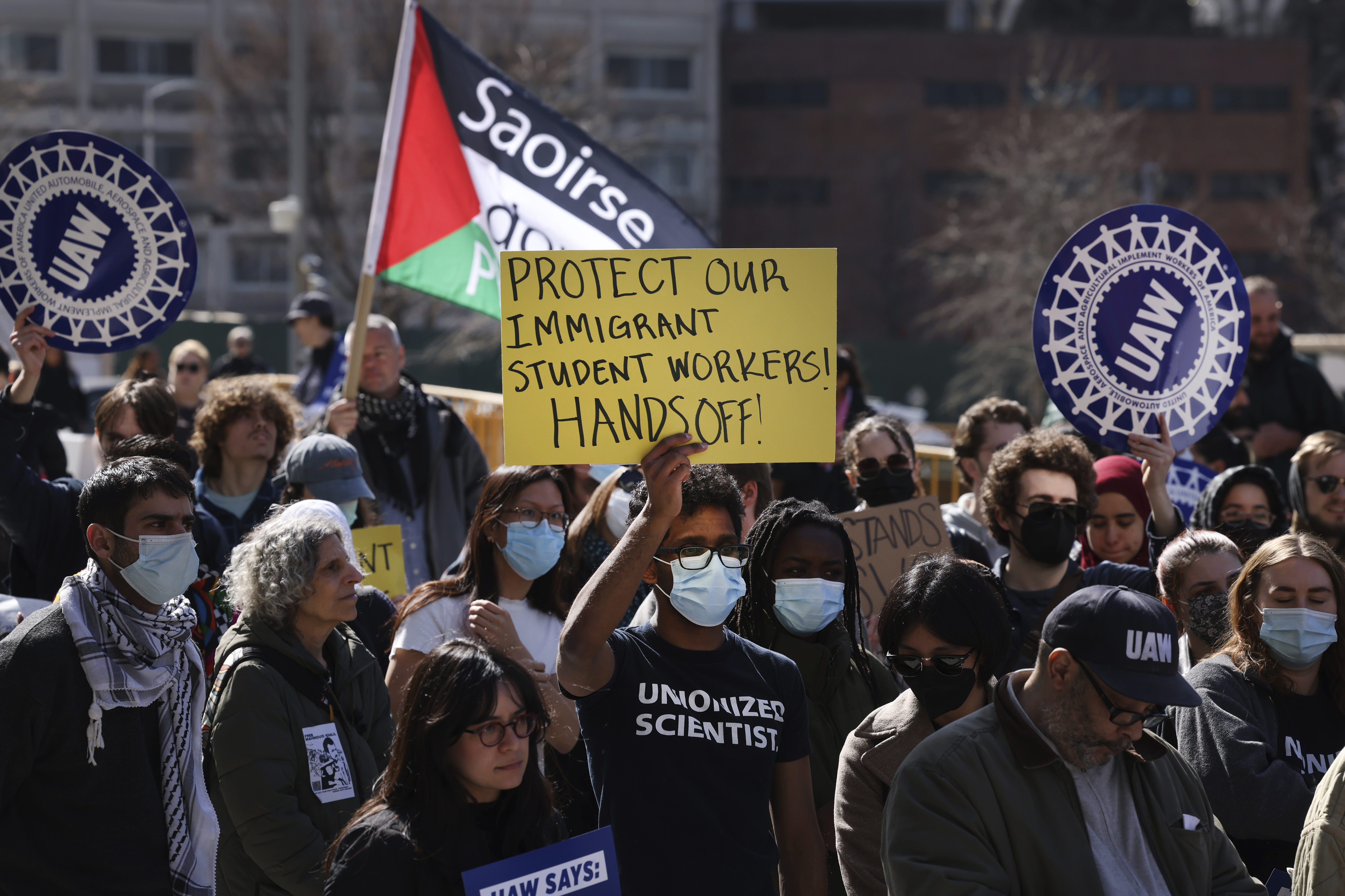 Members of Columbia University's student workers union and their supporters protest the detention of Palestinian activist Mahmoud Khalil and recent actions taken by the Trump administration against the university, Friday, March 14, 2025, in New York. (AP Photo/Jason DeCrow)