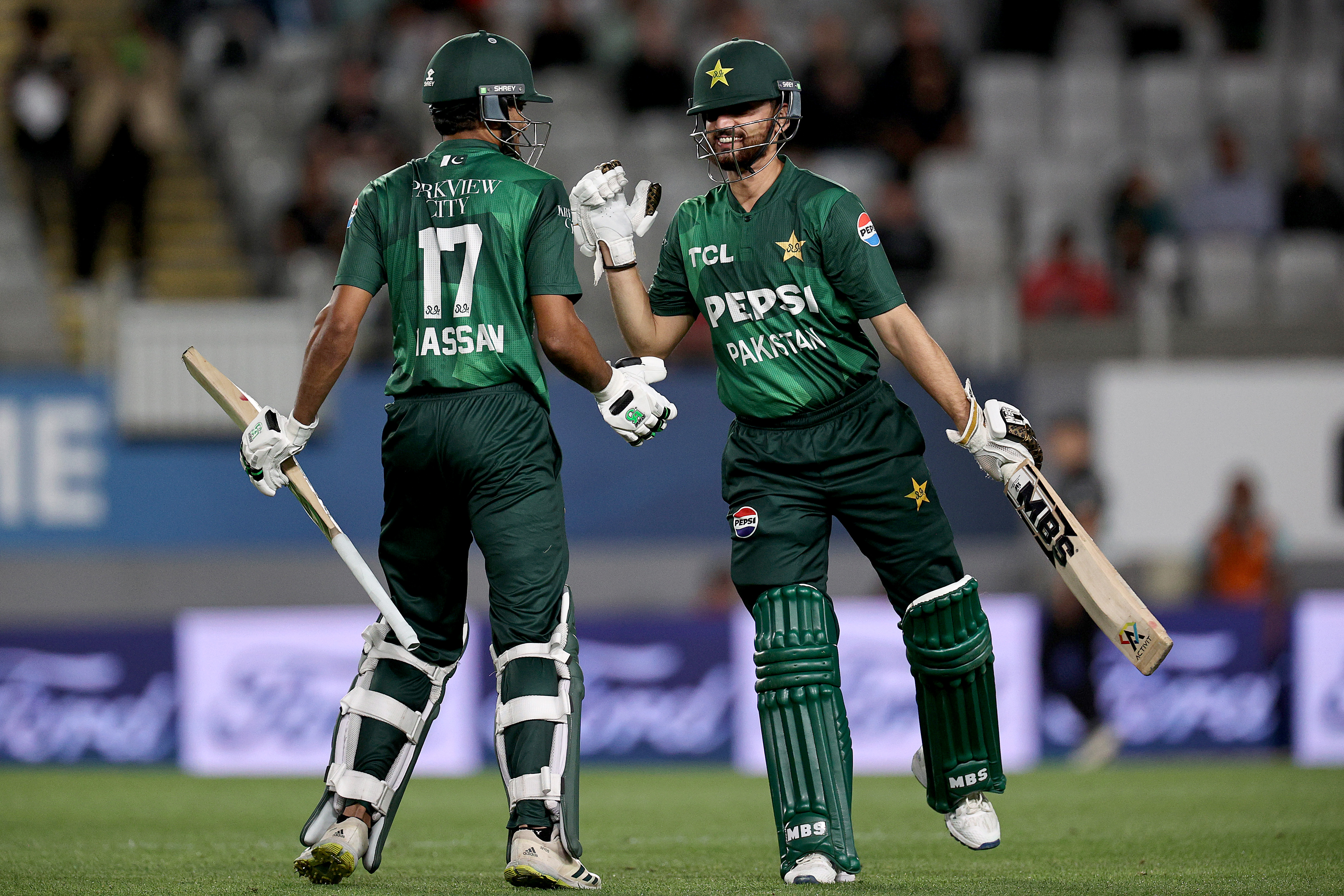 AUCKLAND, NEW ZEALAND - MARCH 21: (L-R) Salman Agha congratulates Hassan Nawaz of Pakistan on scoring 100 runs during game three of the Men's T20 series between New Zealand and Pakistan at Eden Park, on March 21, 2025, in Auckland, New Zealand. (Photo by Dave Rowland/Getty Images)
