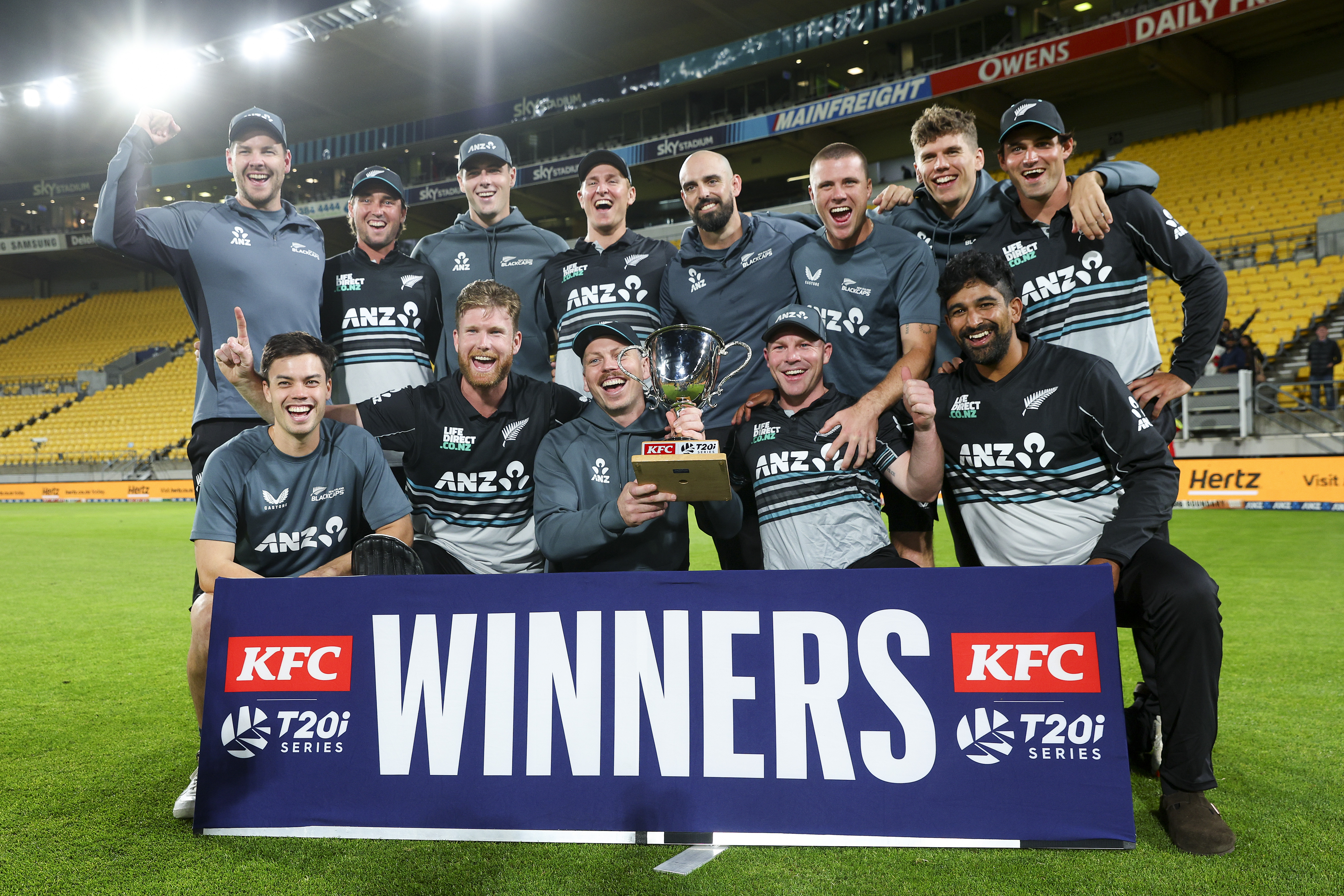 WELLINGTON, NEW ZEALAND - MARCH 26: New Zealand players celebrate with the series trophy after winning game five of the Men's T20 series between New Zealand and Pakistan at Sky Stadium, on March 26, 2025, in Wellington, New Zealand. (Photo by Hagen Hopkins/Getty Images)