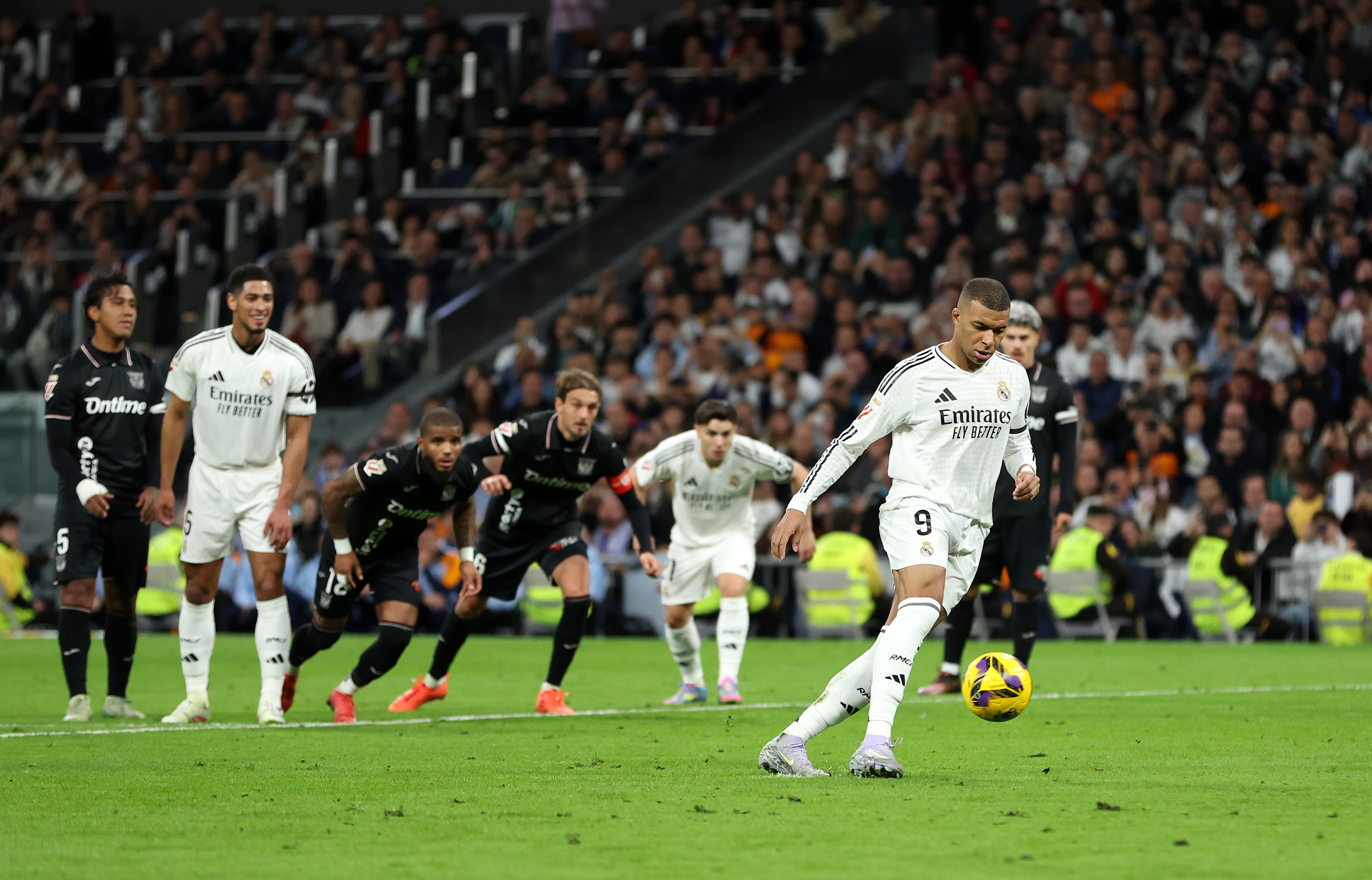 MADRID, SPAIN - MARCH 29: Kylian Mbappe of Real Madrid scores his team's first goal from a penalty kick during the LaLiga match between Real Madrid CF and CD Leganes at Estadio Santiago Bernabeu on March 29, 2025 in Madrid, Spain. (Photo by Florencia Tan Jun/Getty Images)