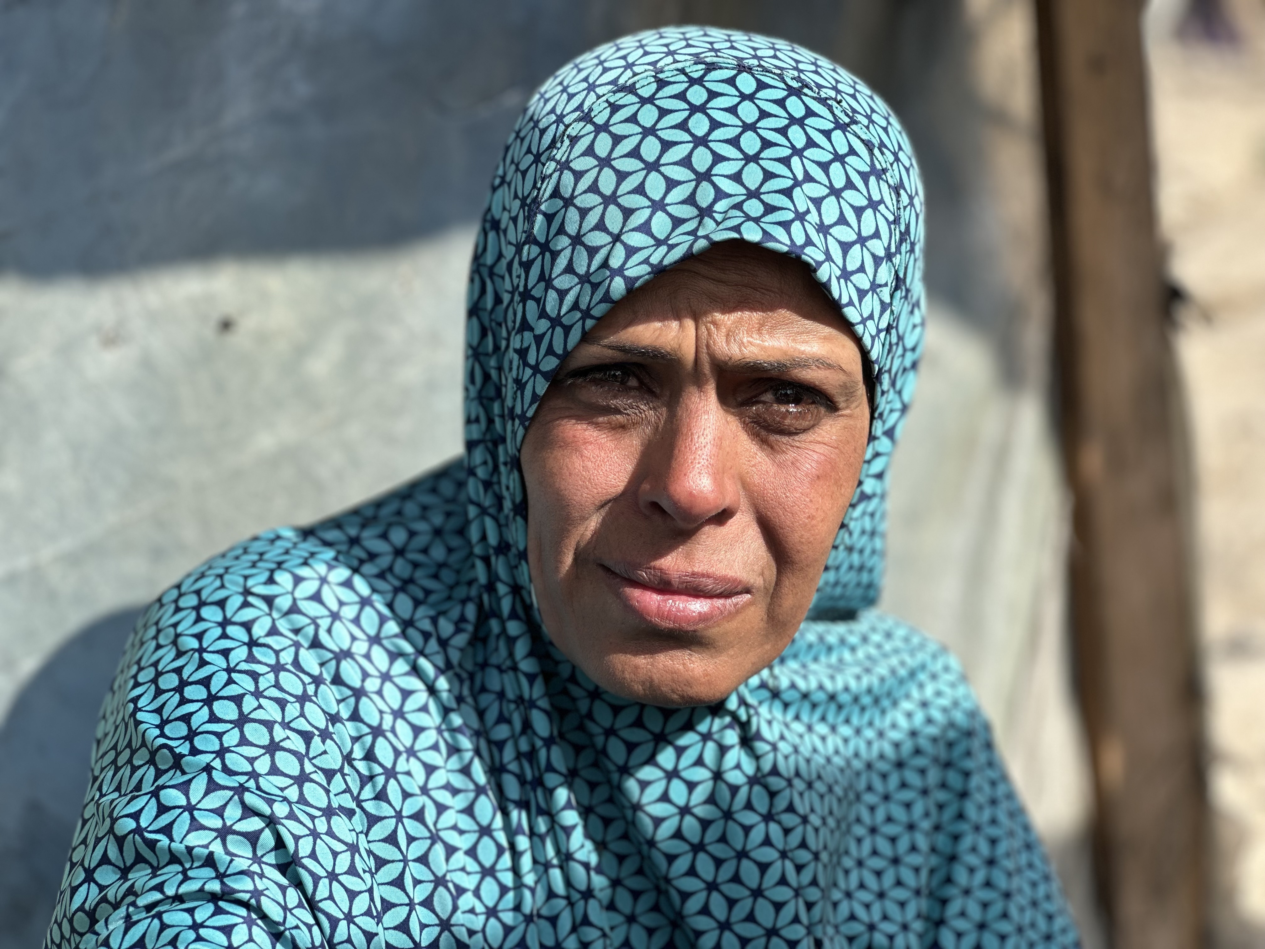 Woman in blue headscarf 