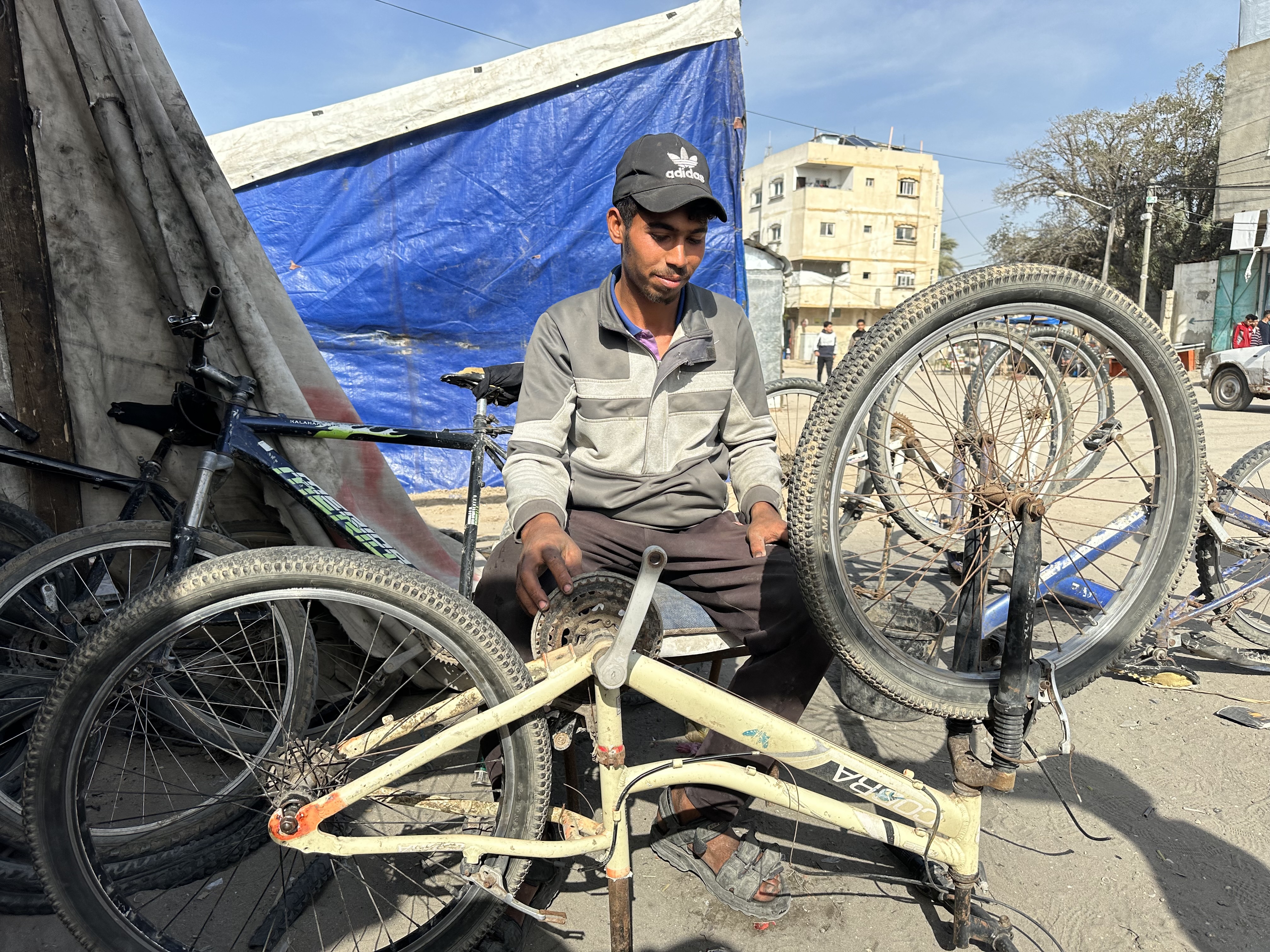 Mahmoud al-Rai fixes a bike