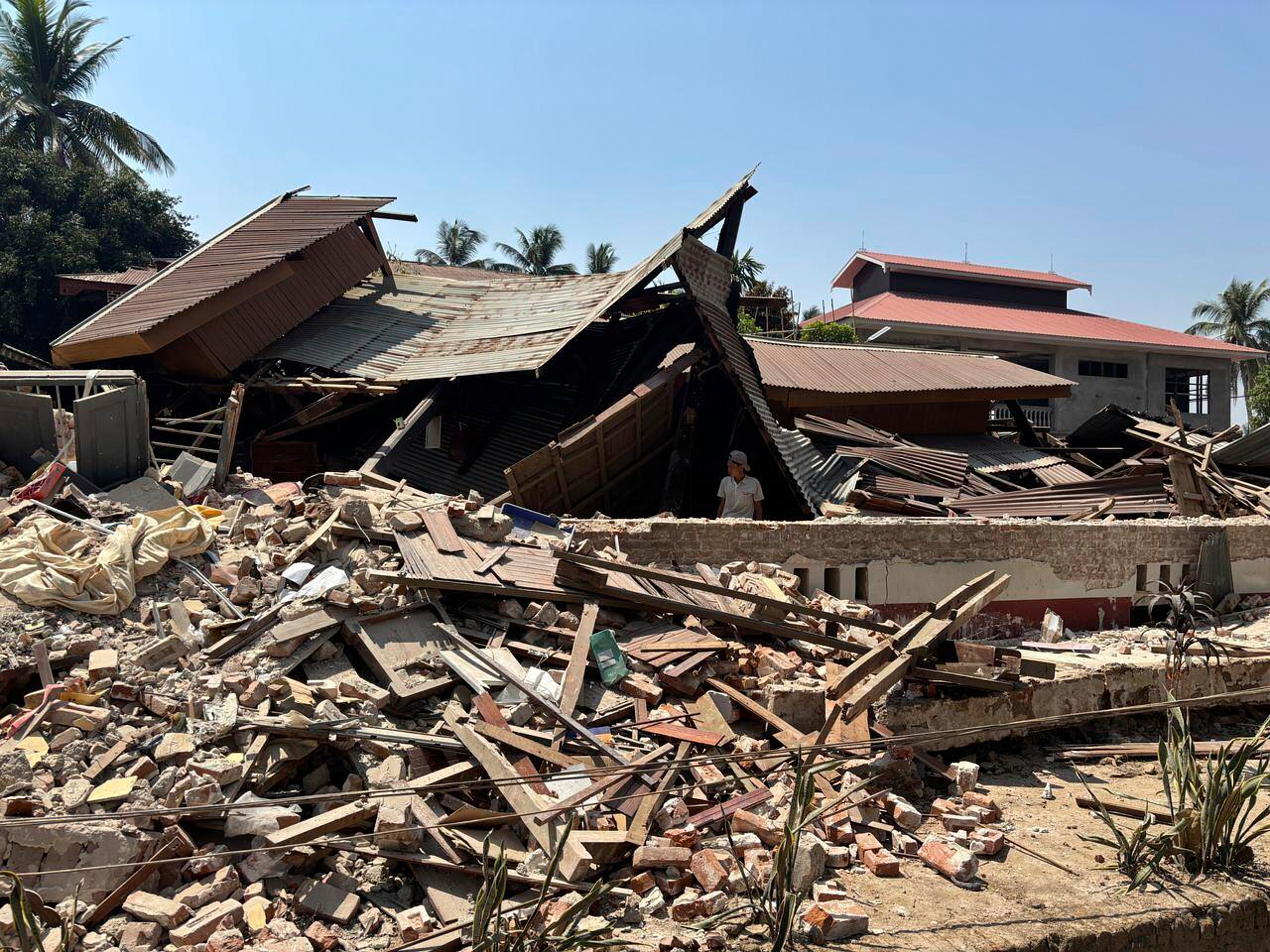 A Buddhist monastery building that has collapsed is seen following an earthquake in Naypyitaw, Myanmar Sunday, March 30, 2025. (AP Photo/Aung Shine Oo)