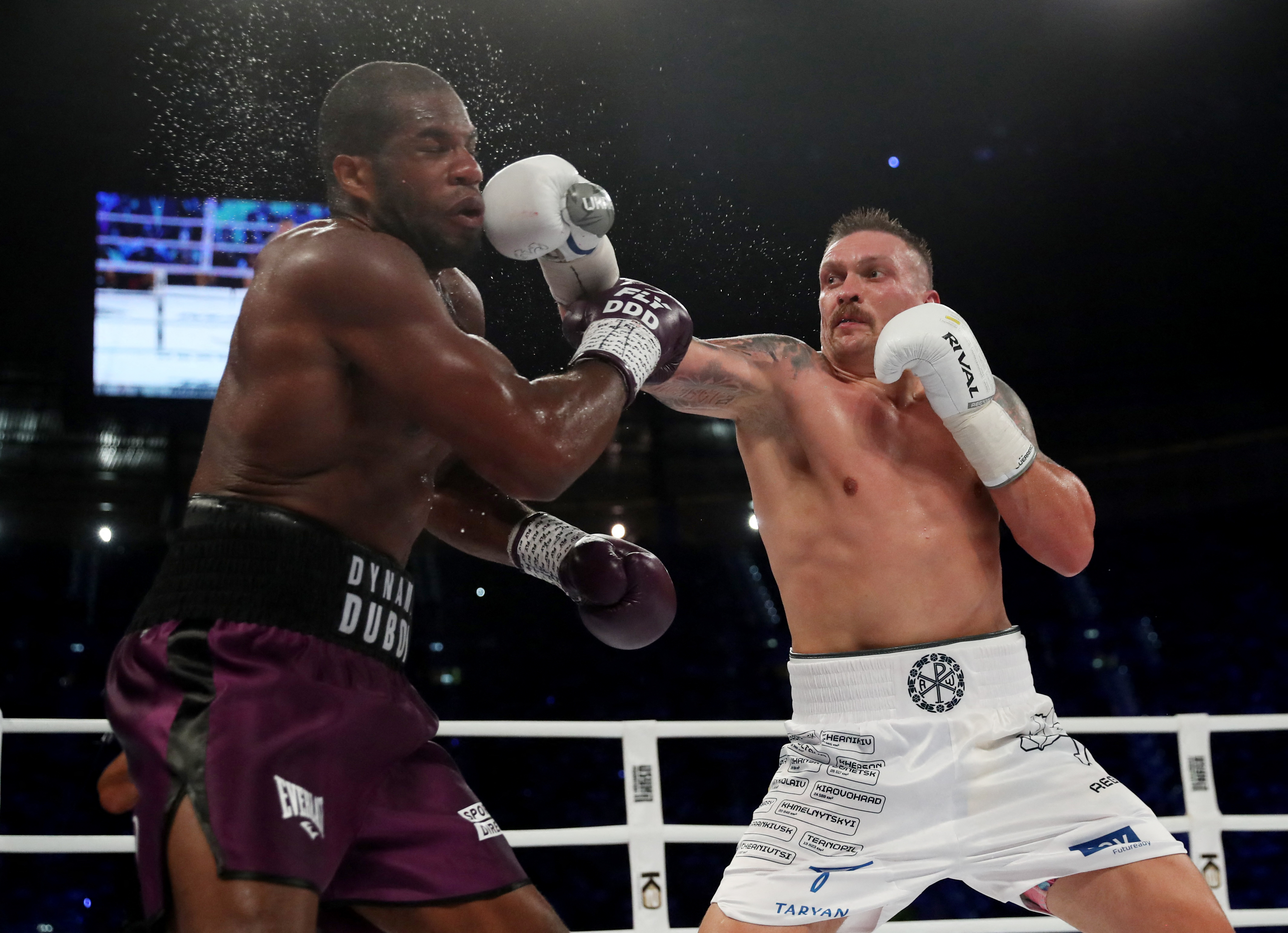 Oleksandr Usyk and Daniel Dubois in action.