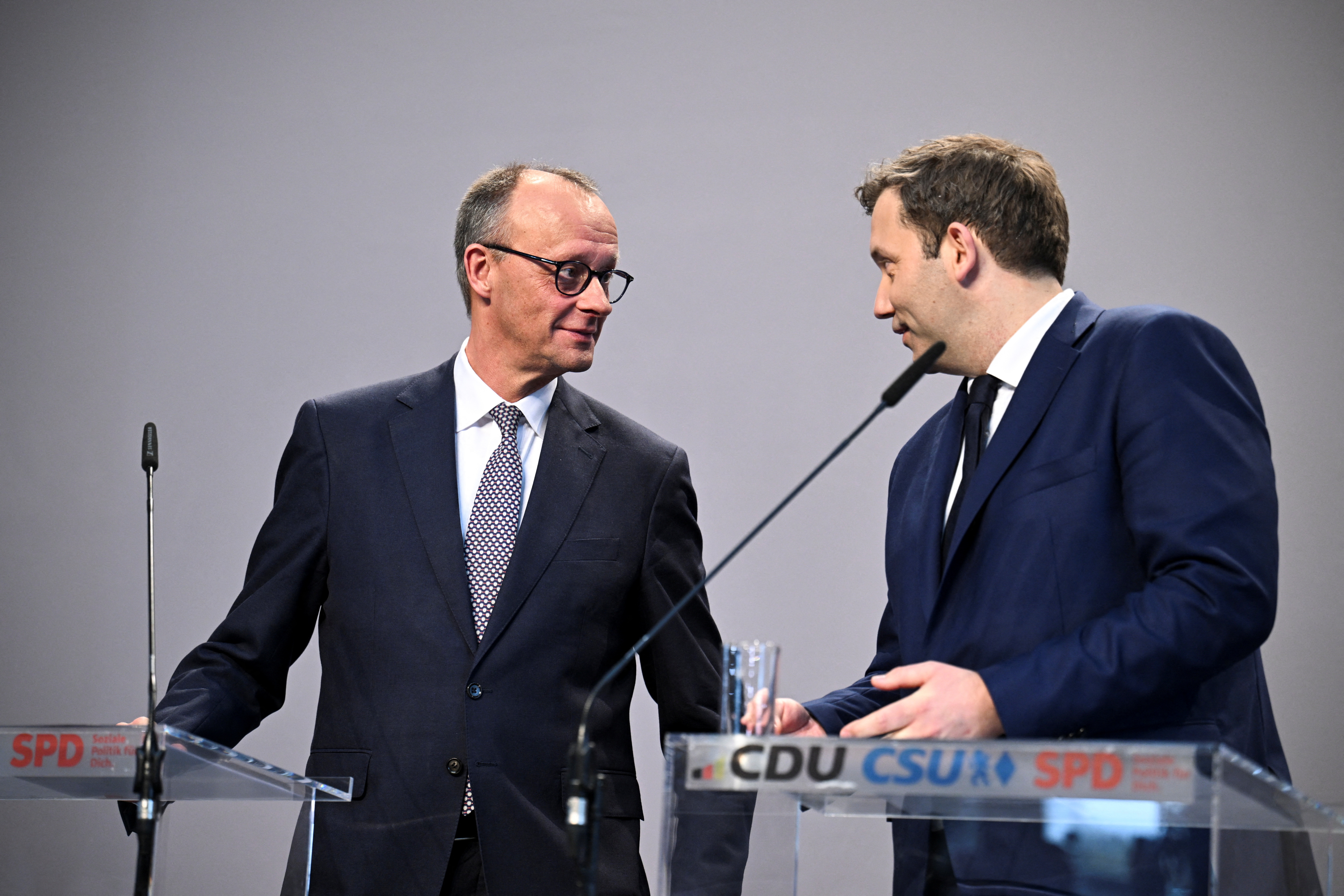 Germany's chancellor-in-waiting and leader of the Christian Democratic Union party (CDU) Friedrich Merz and co-leader of the Social Democratic party (SPD) Lars Klingbeil attend a press conference