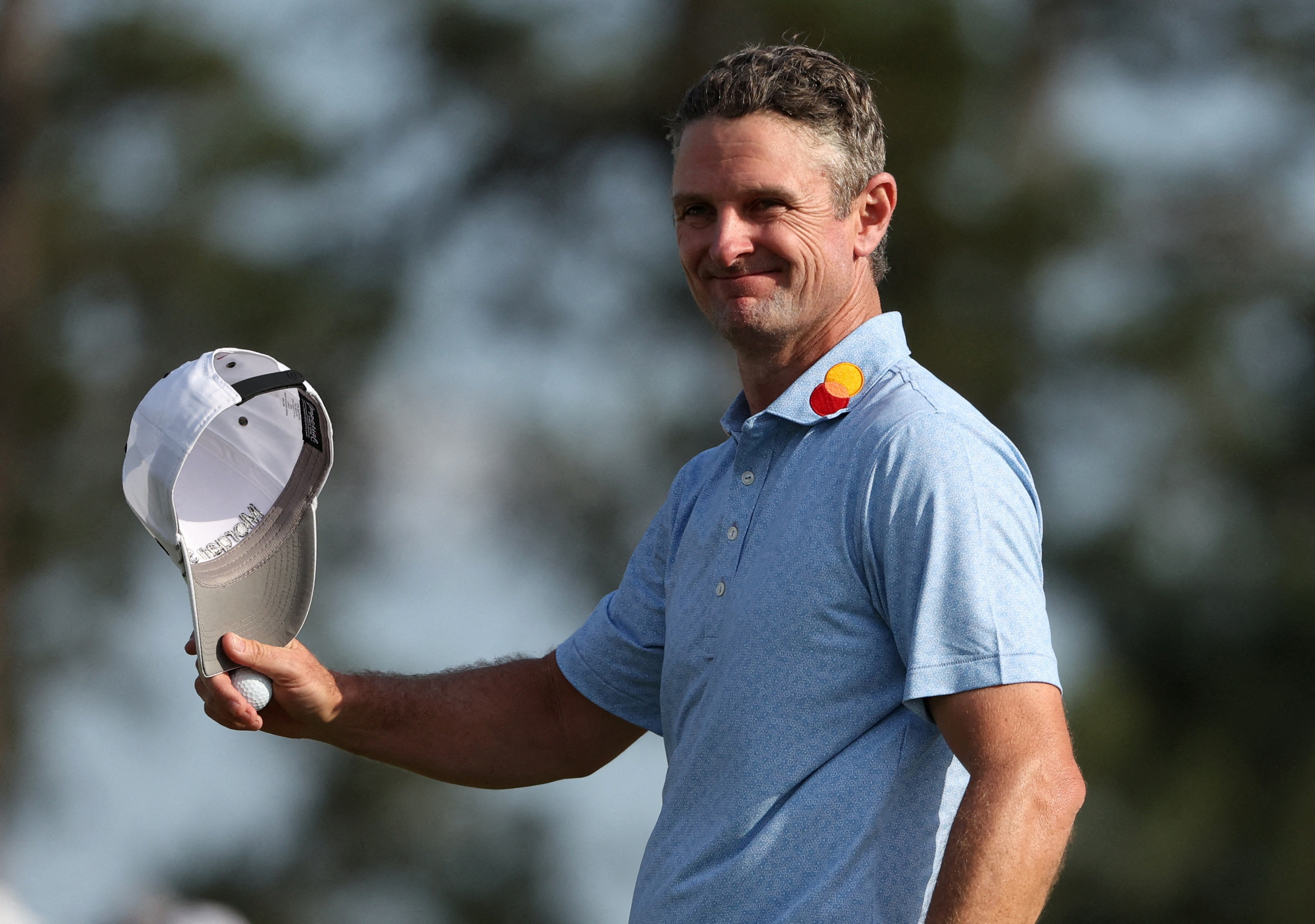 England's Justin Rose reacts after holing his putt.