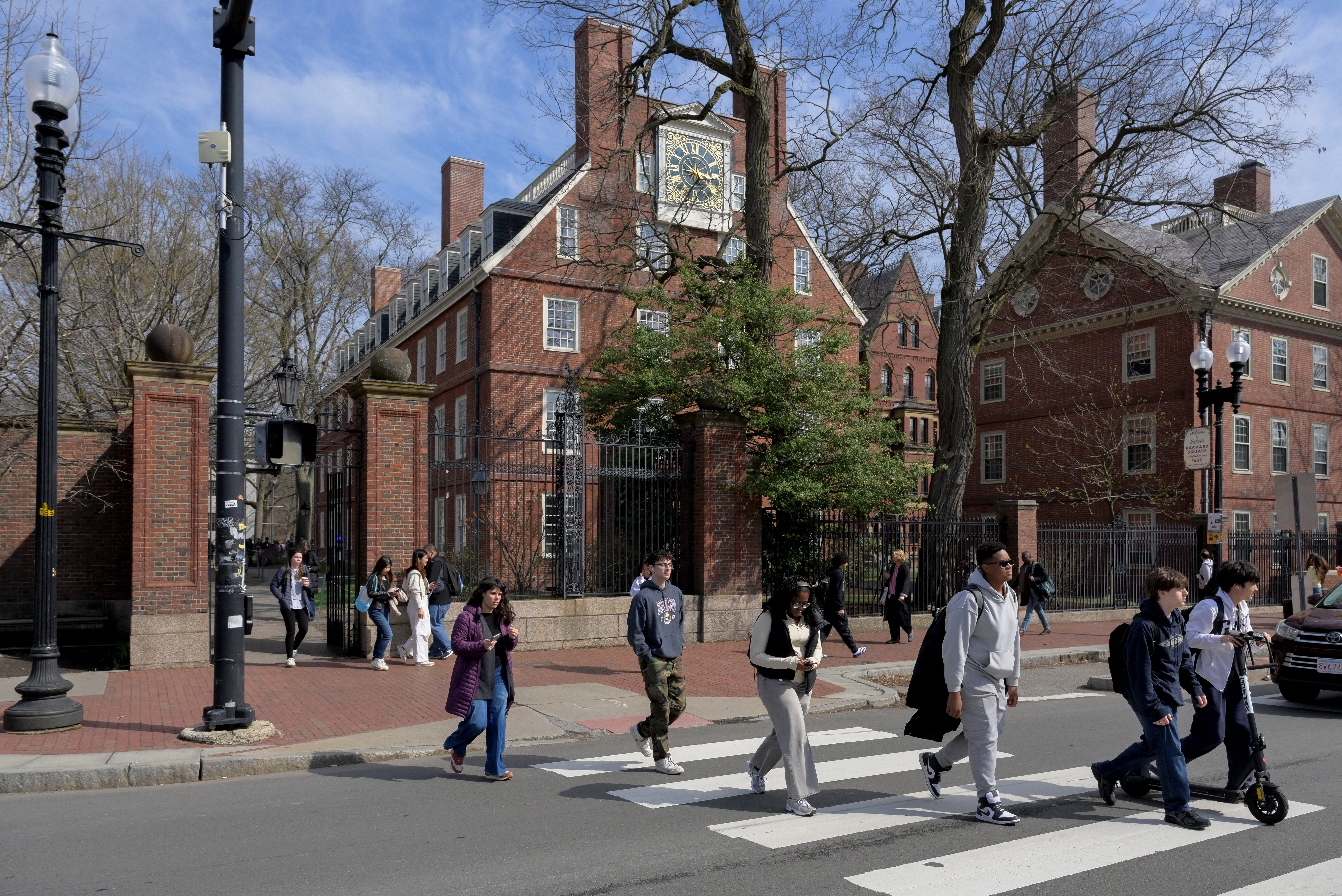 Students walk outside Harvard Yard at Harvard University.
