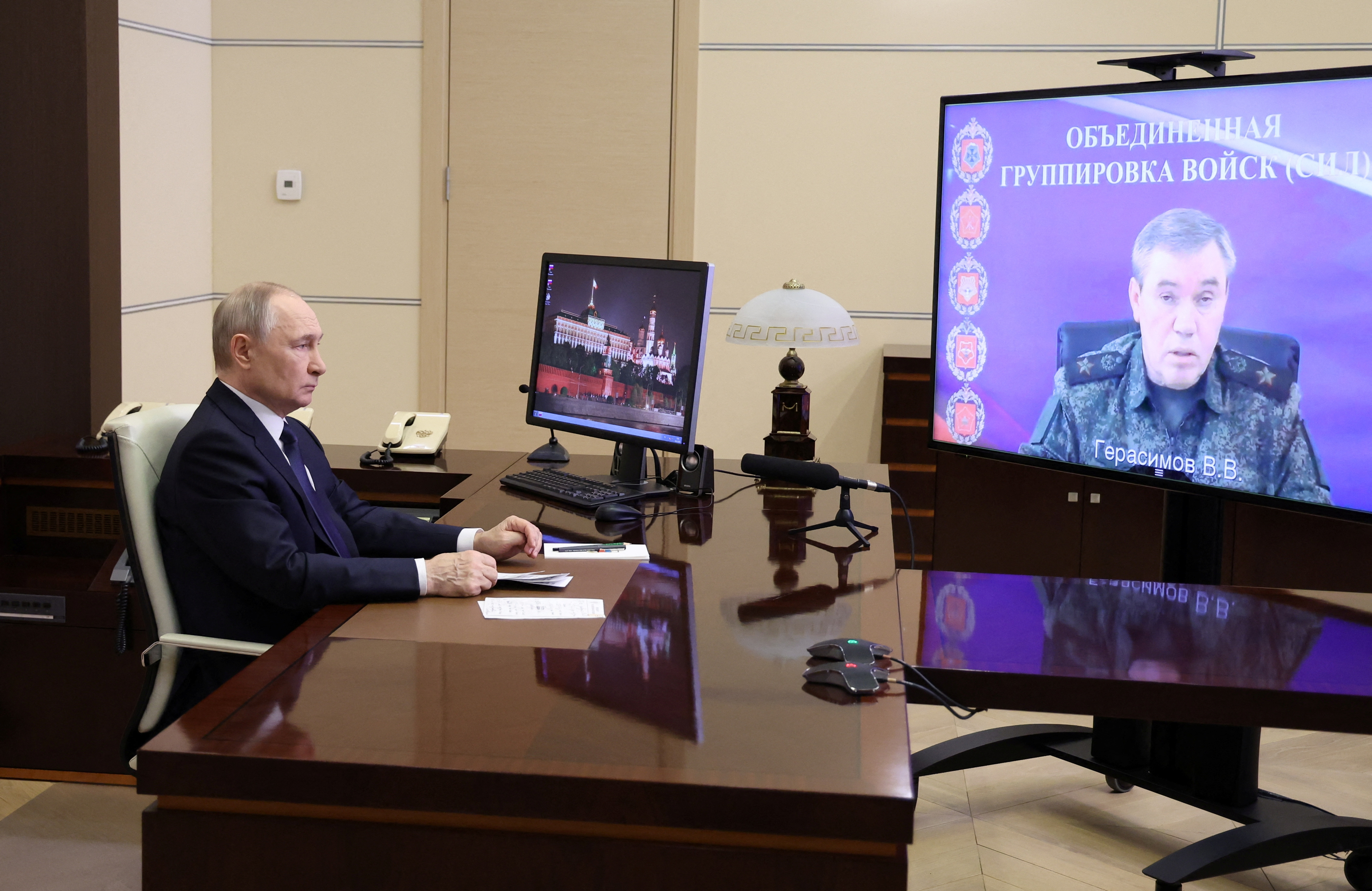 Russian President Vladimir Putin listens to a report of Chief of the General Staff of Russian Armed Forces Valery Gerasimov via videolink.