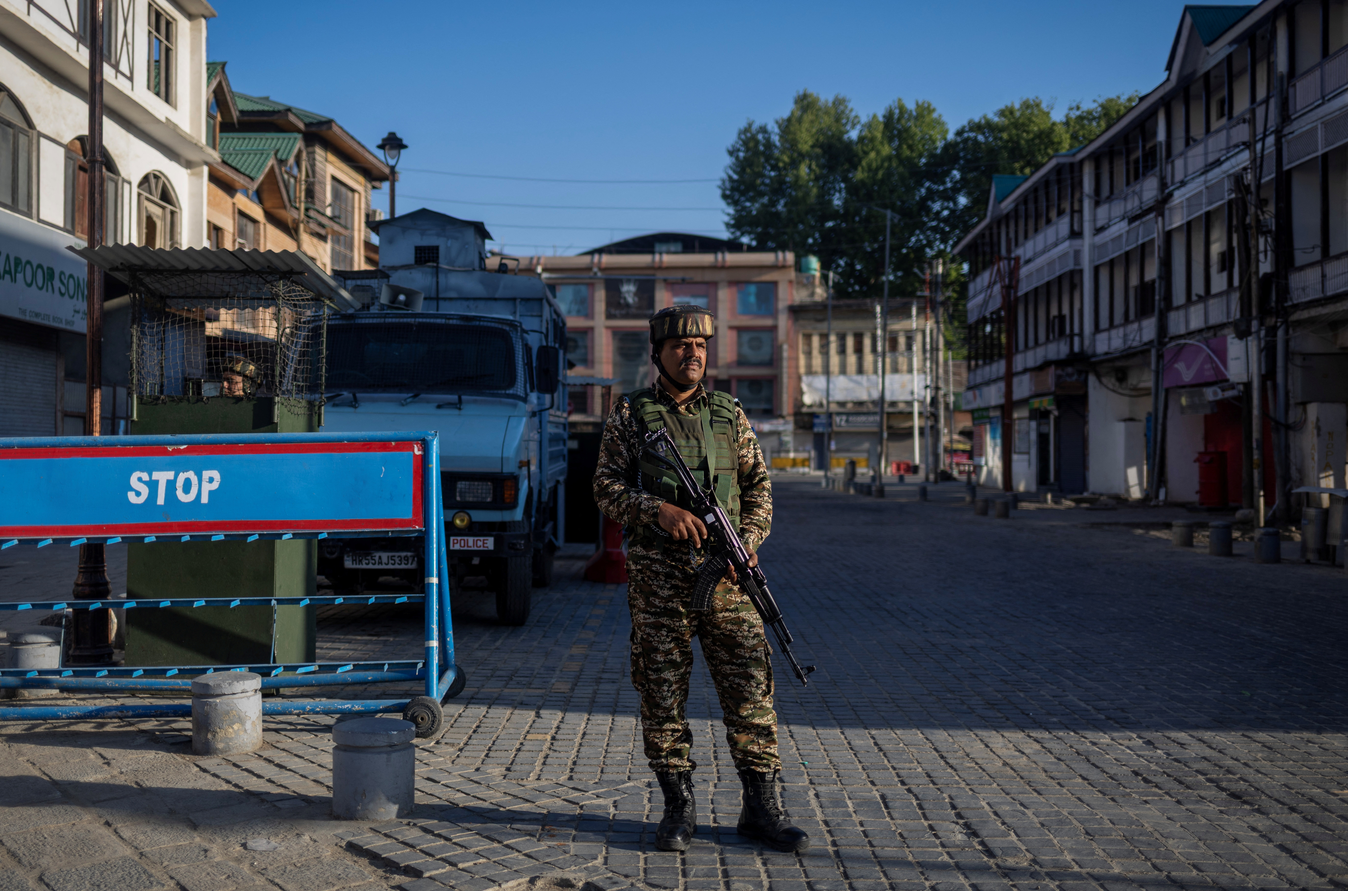 An Indian security force personnel stands guard on a street, following an attack on tourists near Pahalgam in south Kashmir, in Srinagar, April 29, 2025.