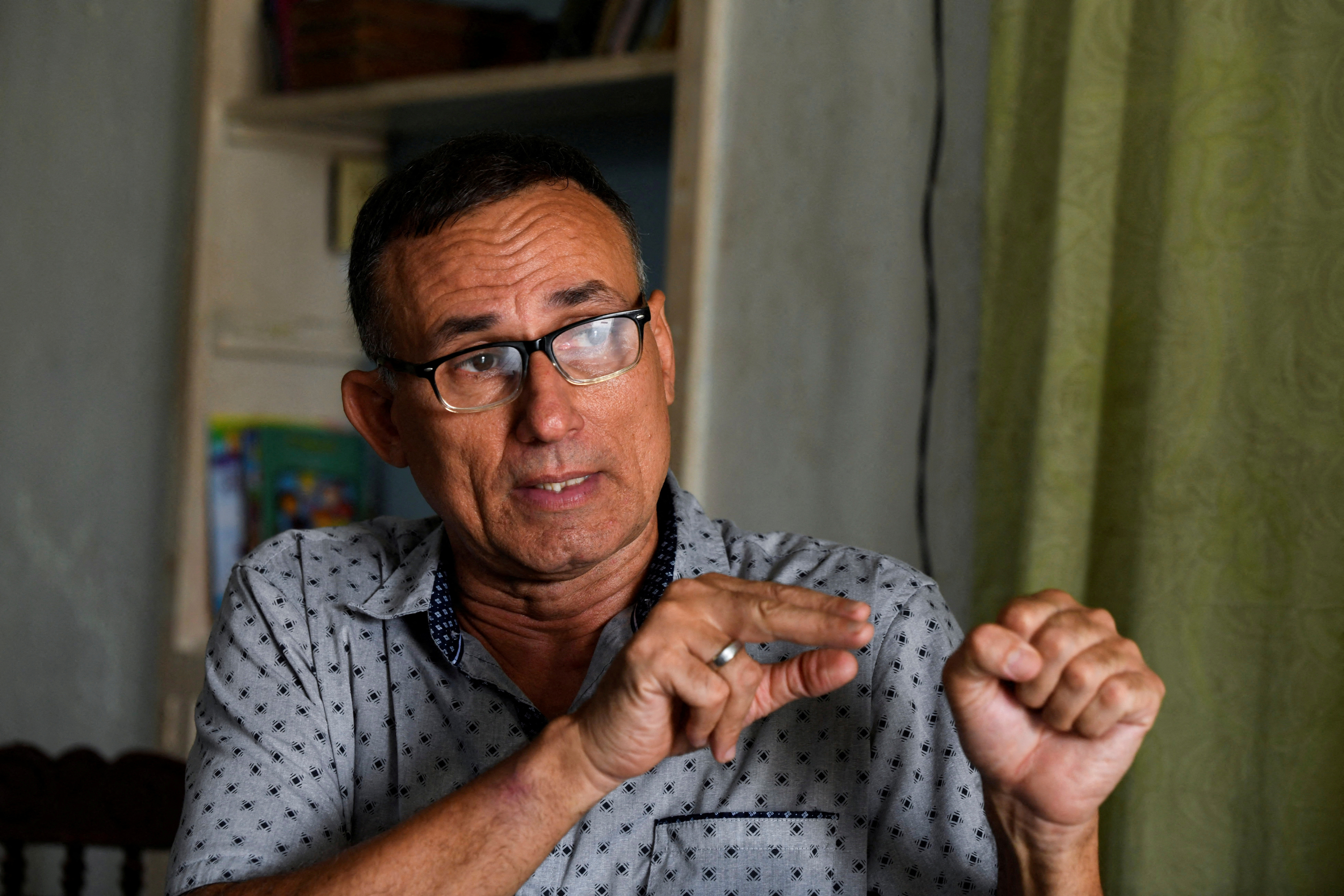 Jose Daniel Ferrer speaks at his home in Santiago de Cuba.