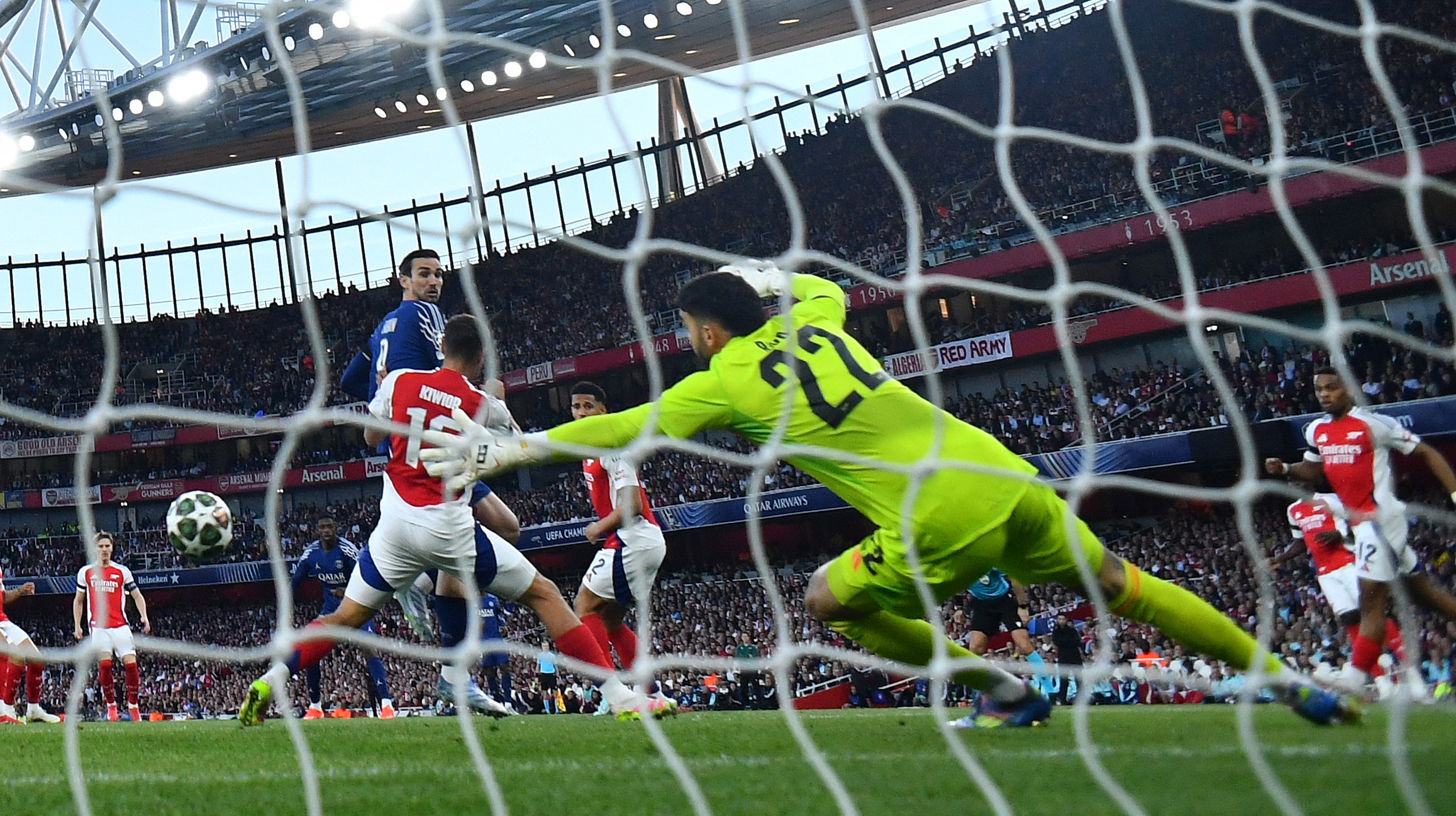 Soccer Football - Champions League - Semi Final - First Leg - Arsenal v Paris Saint Germain - Emirates Stadium, London, Britain - April 29, 2025 Paris St Germain's Ousmane Dembele scores their first goal past Arsenal's David Raya REUTERS/Dylan Martinez
