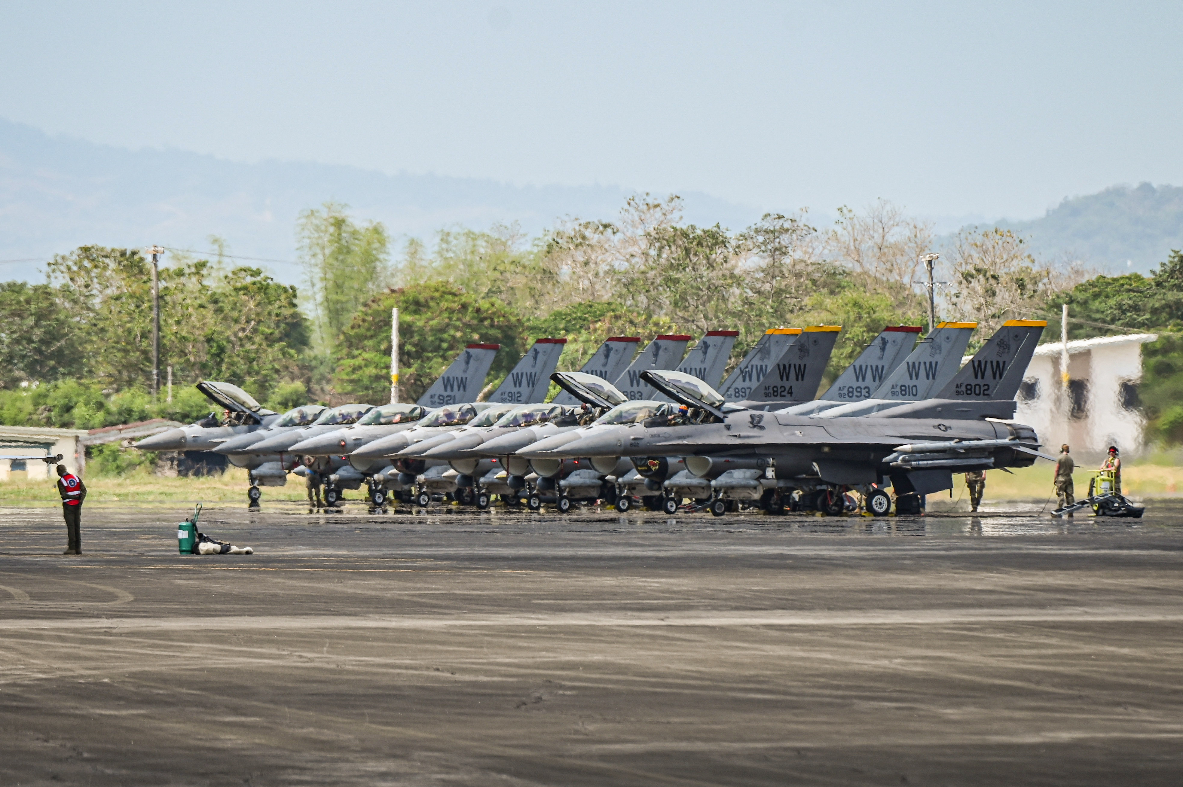 US Air Force F-16 fighter jets are parked during the US-Philippines joint air force military exercise dubbed 'Cope Thunder' at Basa Air Base in Pampanga on April 11, 2024. (Photo by JAM STA ROSA / AFP)