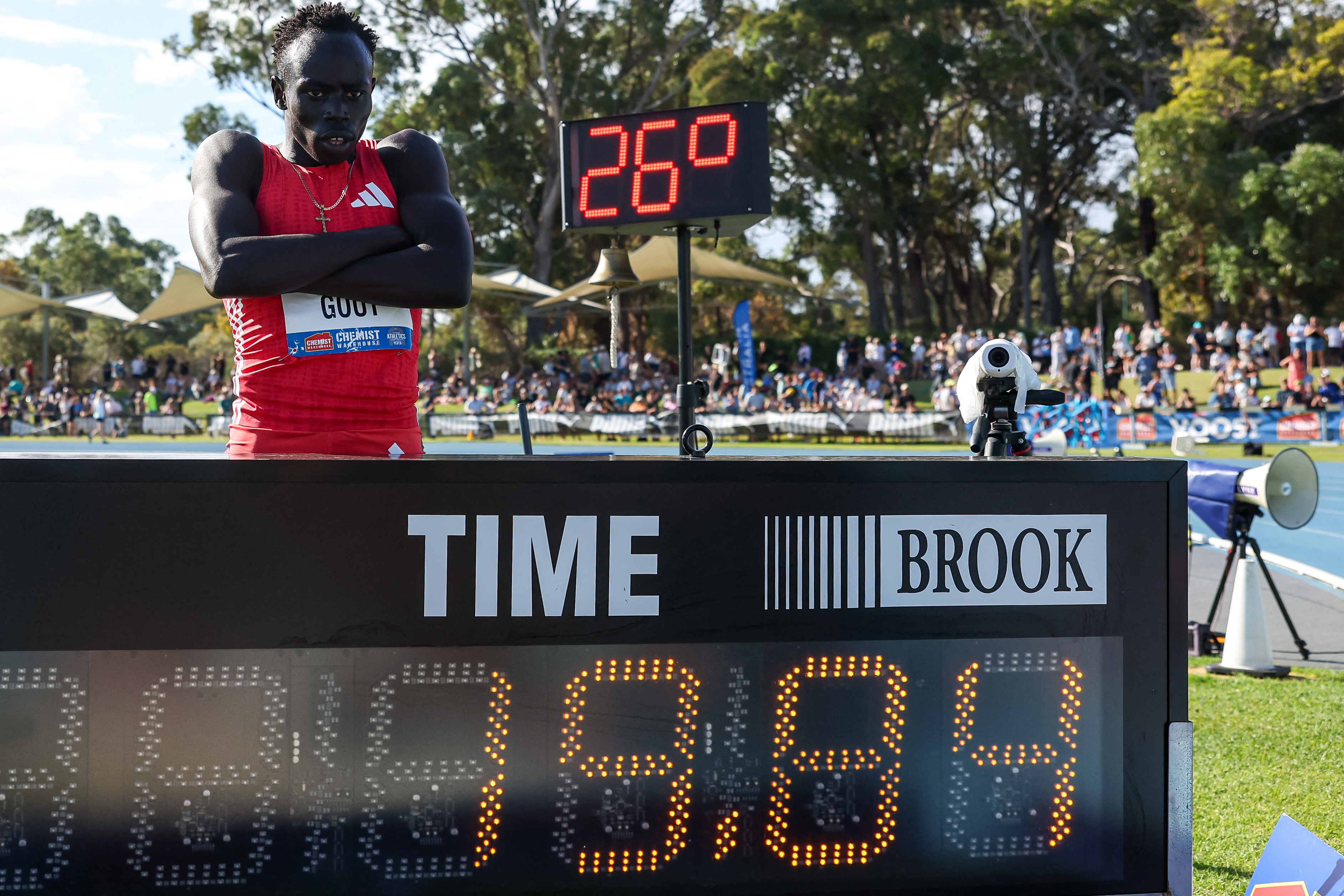 Australia's Gout Gout poses next to his time of 19.84 after winning the men's 200m final during the Australian Athletics Championships in Perth on April 13, 2025. (Photo by COLIN MURTY / AFP) / -- IMAGE RESTRICTED TO EDITORIAL USE - STRICTLY NO COMMERCIAL USE --
